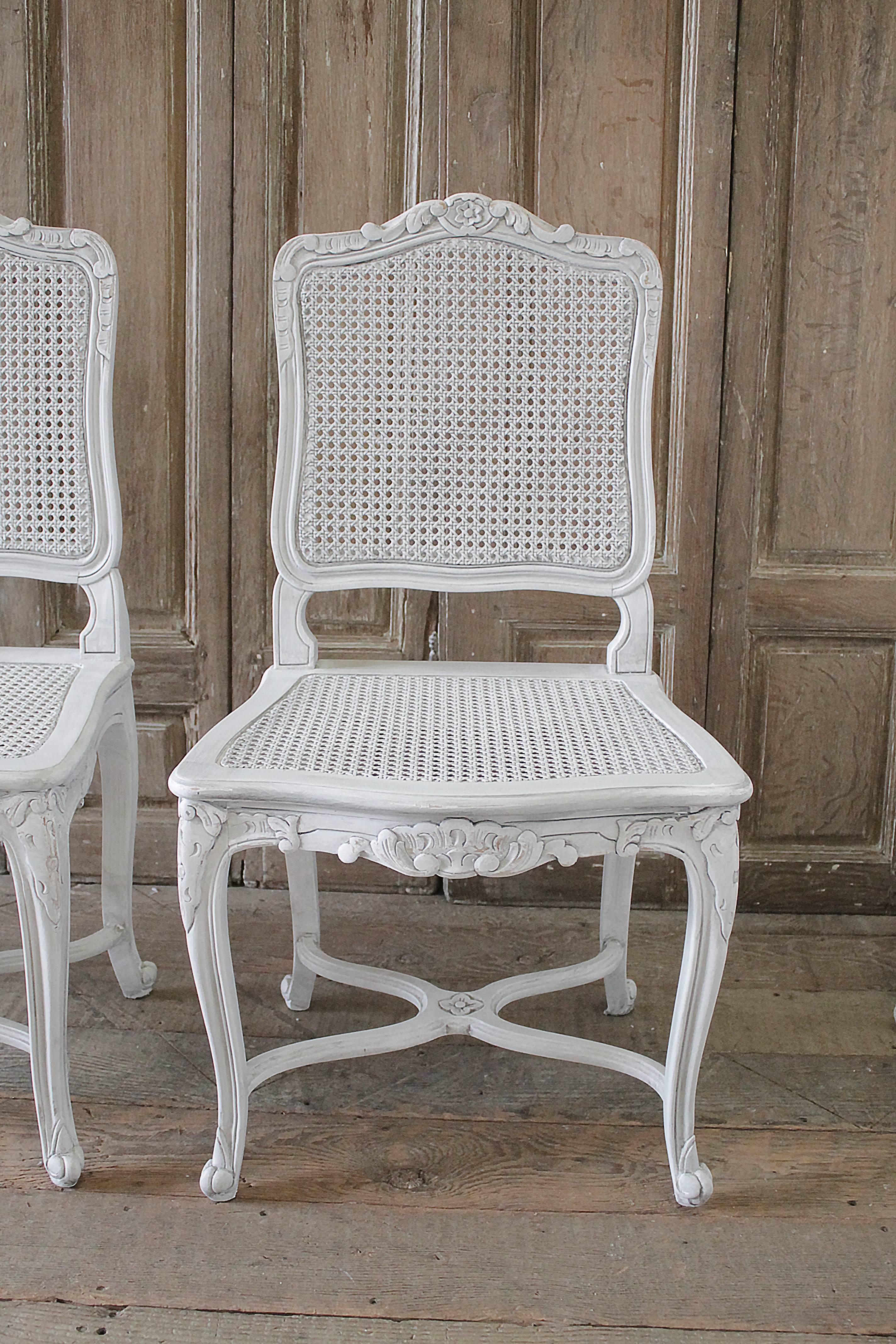 Seat of four antique French Country style cane back dining chairs
Painted in oyster white, with subtle distressed edges, and finished with an antique glaze. Color of the paint is a subtle soft grayish tone.
Cane is solid and strong on the seats