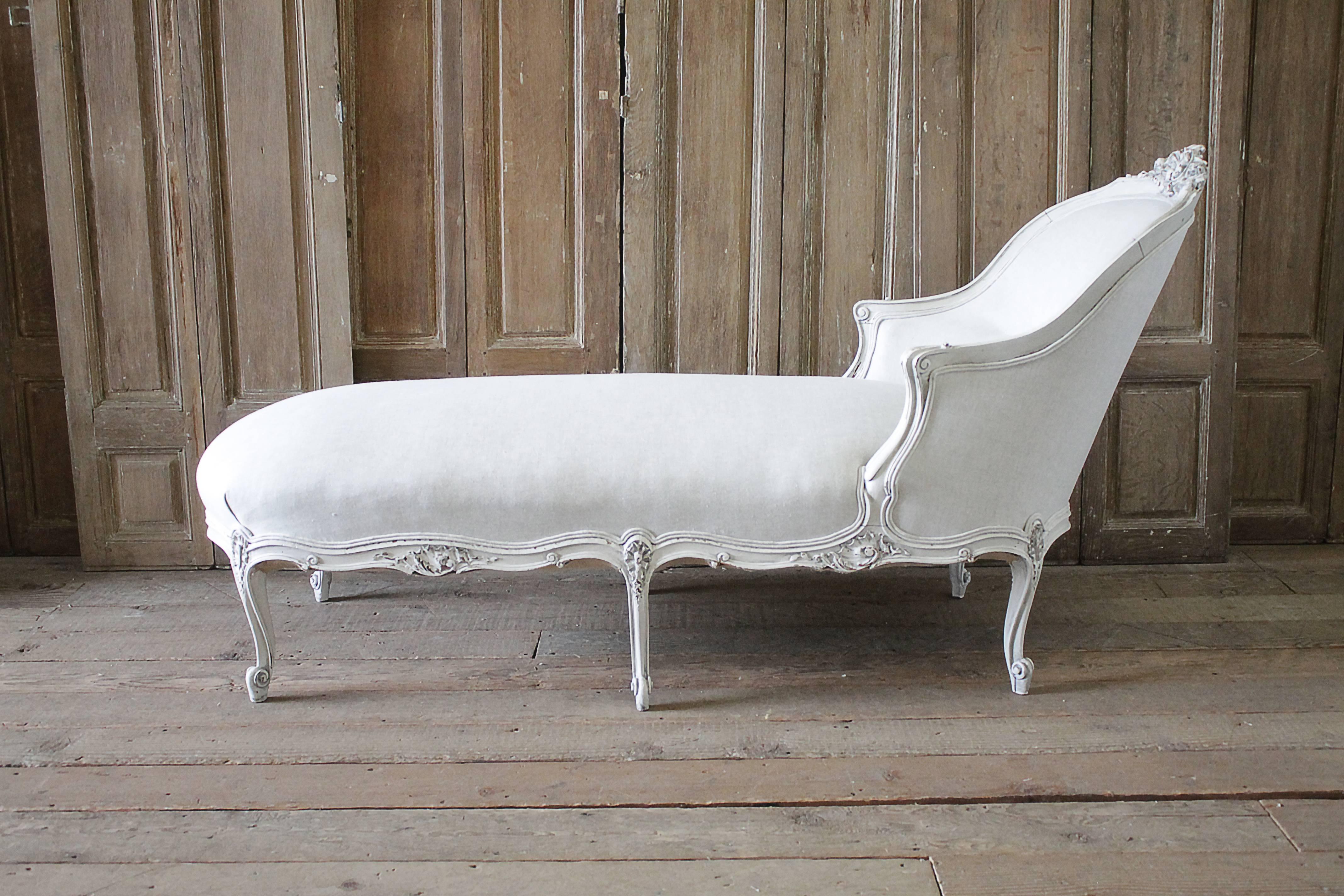 Pretty painted chaise longue painted in a light oyster white with subtle distressed edges, and antique glazed patina. We reupholstered this recamier in in an oatmeal Belgian linen, finished in a double welt trim.
Large Rococo shell carving with