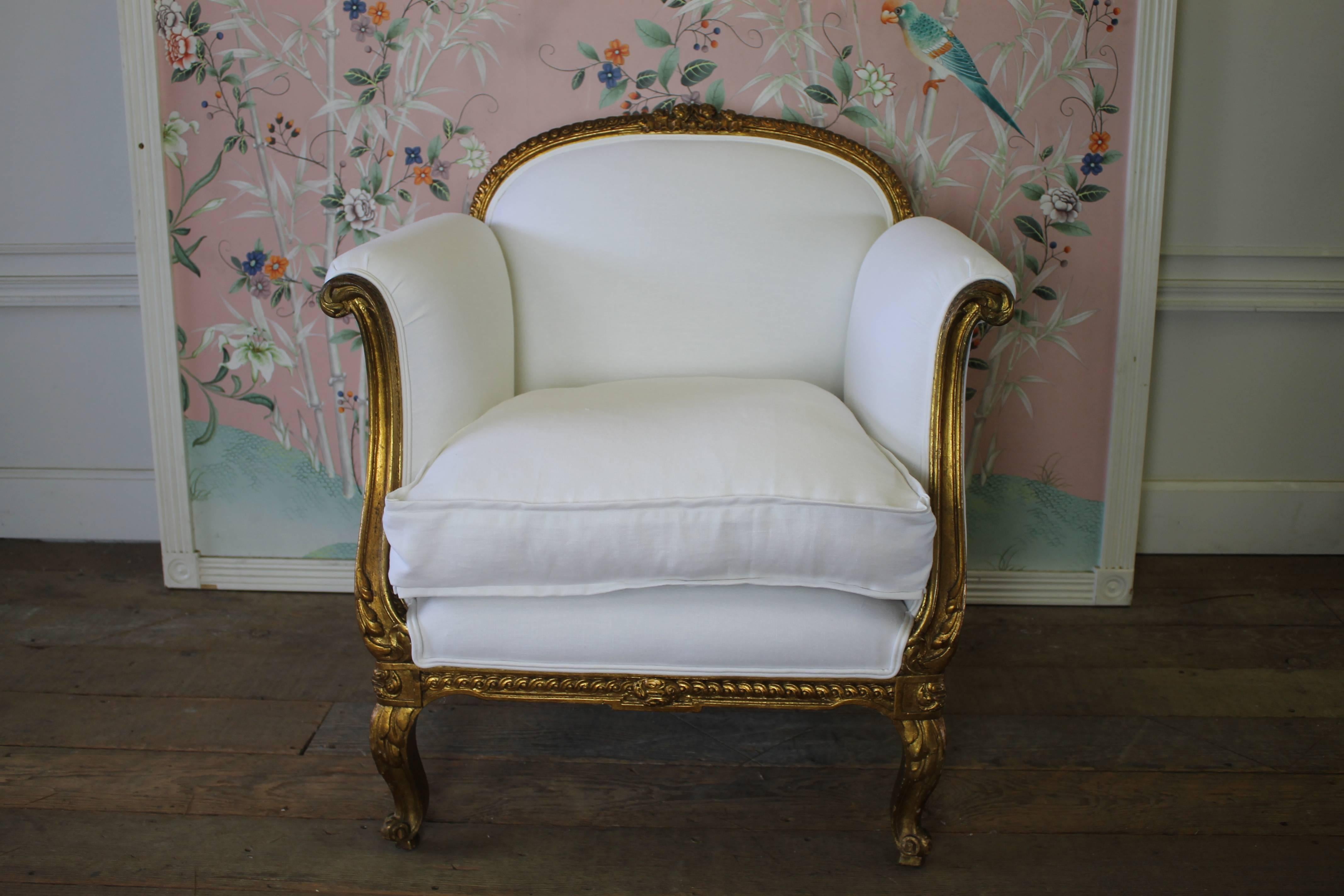 Antique French Louis XV Style Gilded Club Chair in White Belgian Linen
Finished with a double welt trim, this white Belgian linen has been prewashed giving it a very soft hand, the seat cushion is a plum down wrapped, with slip covered seat.  The