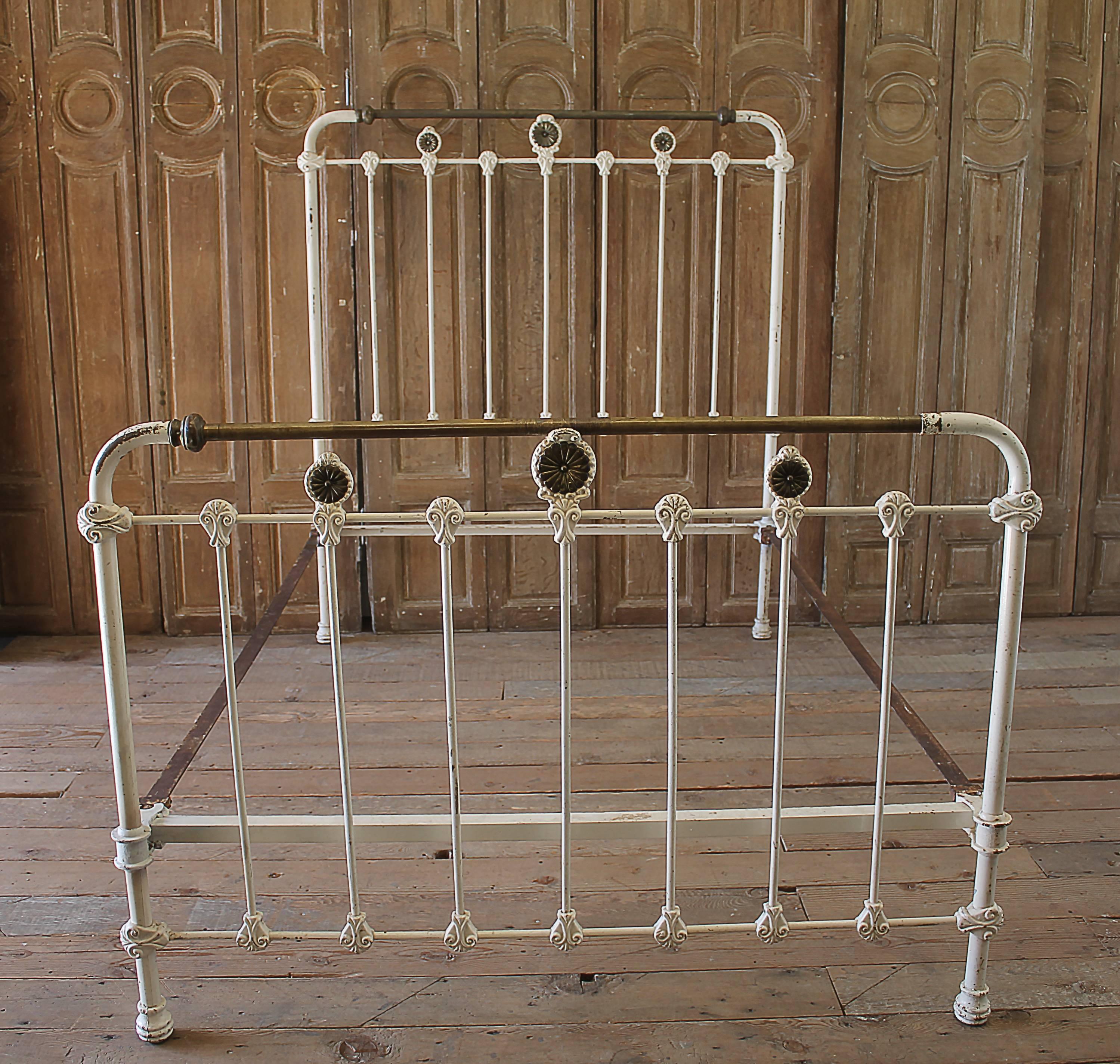 Antique Wrought Iron and Brass Bed Full Size
Original rails, this beautiful original painted bed is a creamy white color with aged brass details.
Fits a full size mattress, measures:55