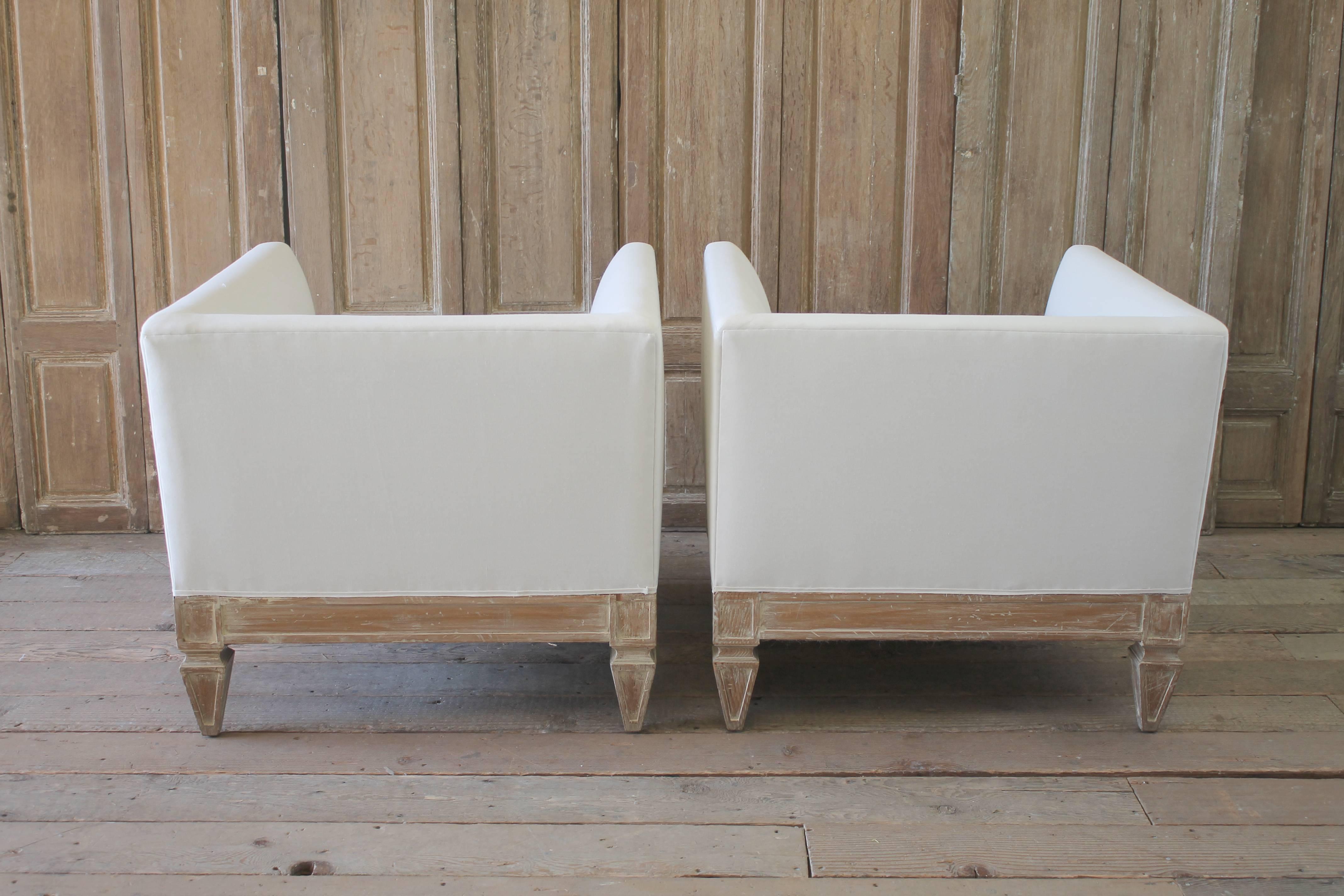 American Pair of Linen Slip Covered Club Chairs with Wood Base