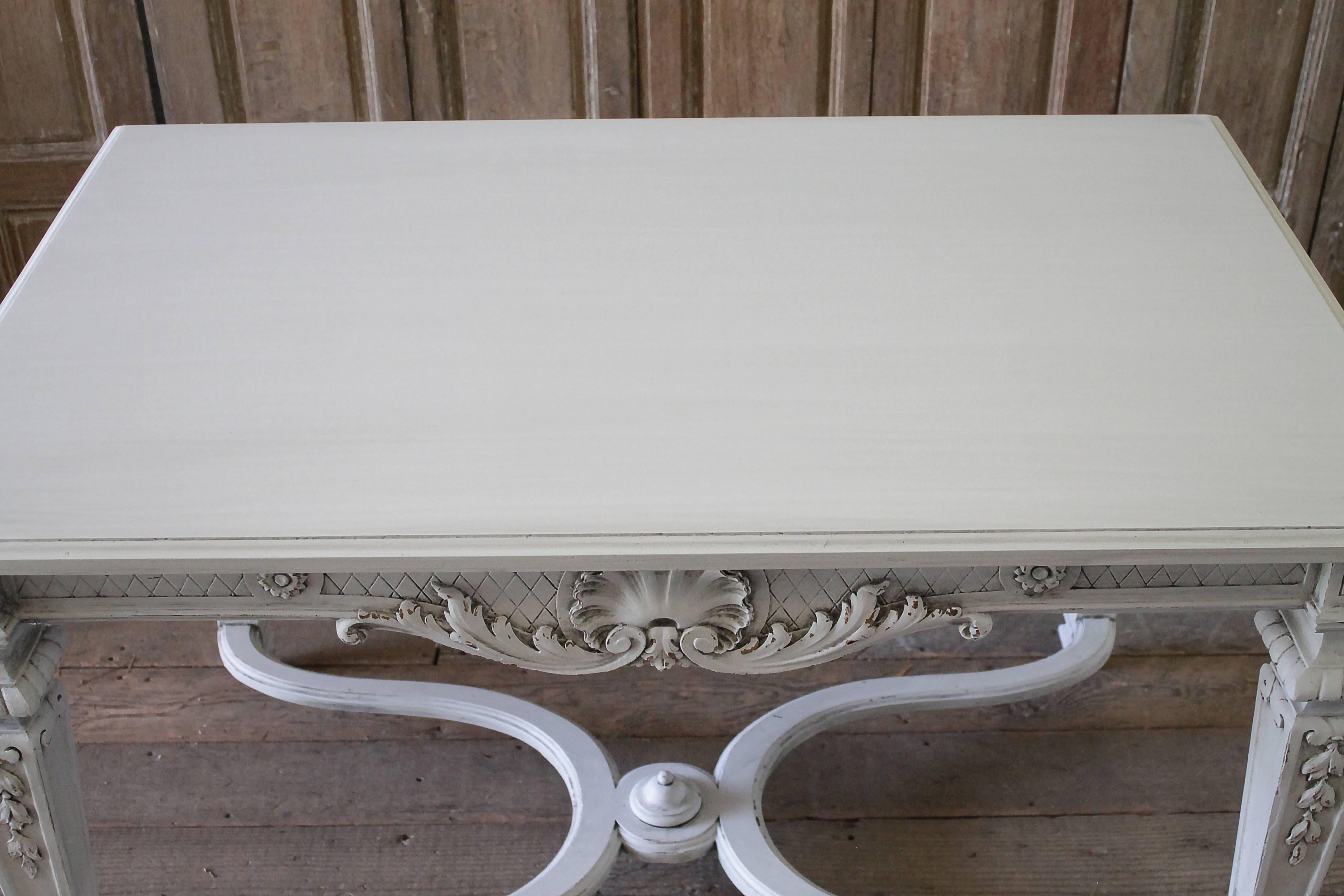 20th century carved and painted neoclassical style centre table
Paint finish is new in a soft oyster white finish, subtle distressed edges, and antique glazed patina.
Table is strong and sturdy, ready for everyday use.
Measures: 49.5