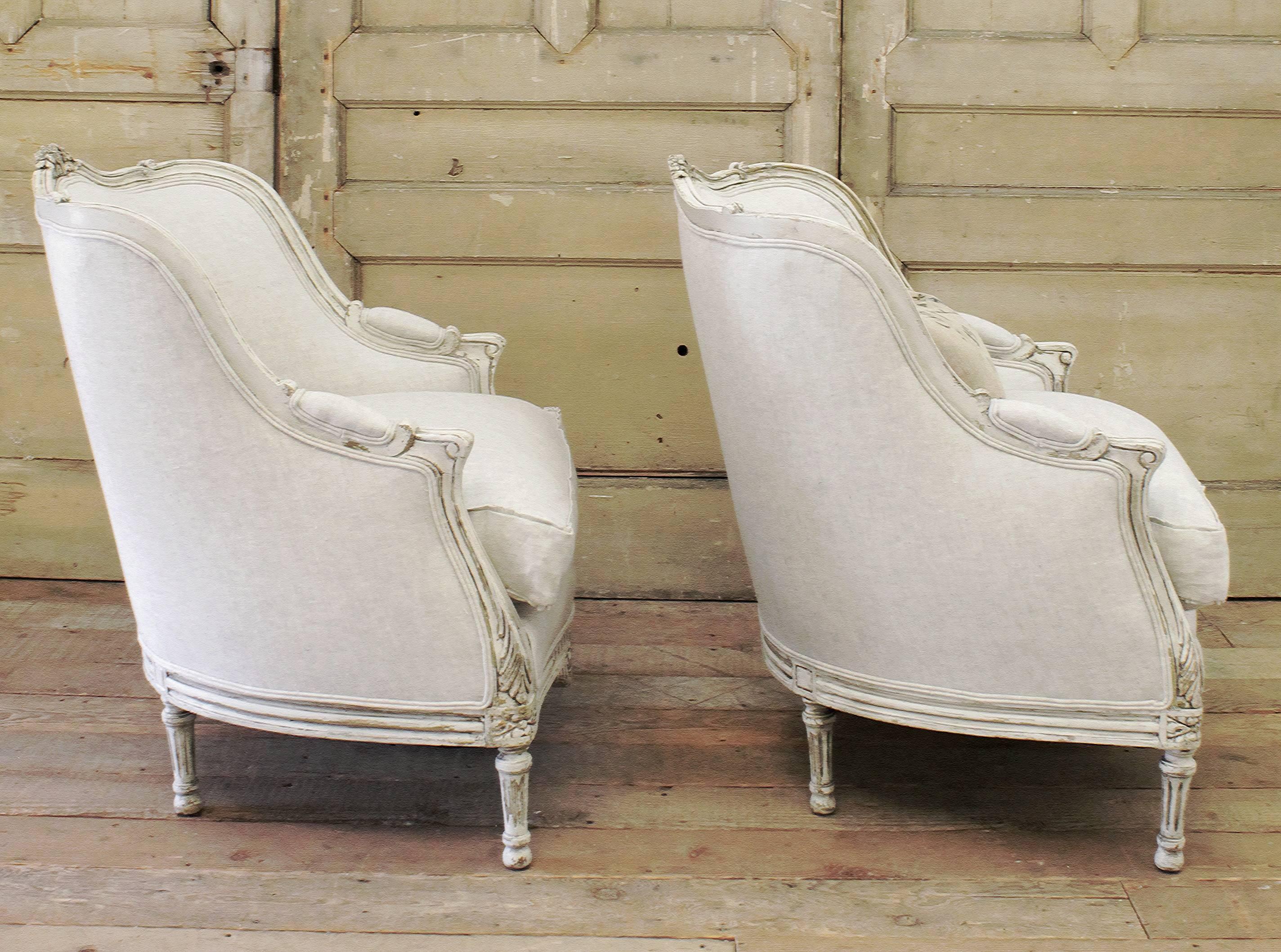 These chairs were painted in a soft oyster white, with antique patina, circa 1900, We reupholstered these in a heavy 15oz Belgian linen, color is a soft oatmeal which has natural and grey tones. 100% Pure Linen.
New down wrapped seat cushions,