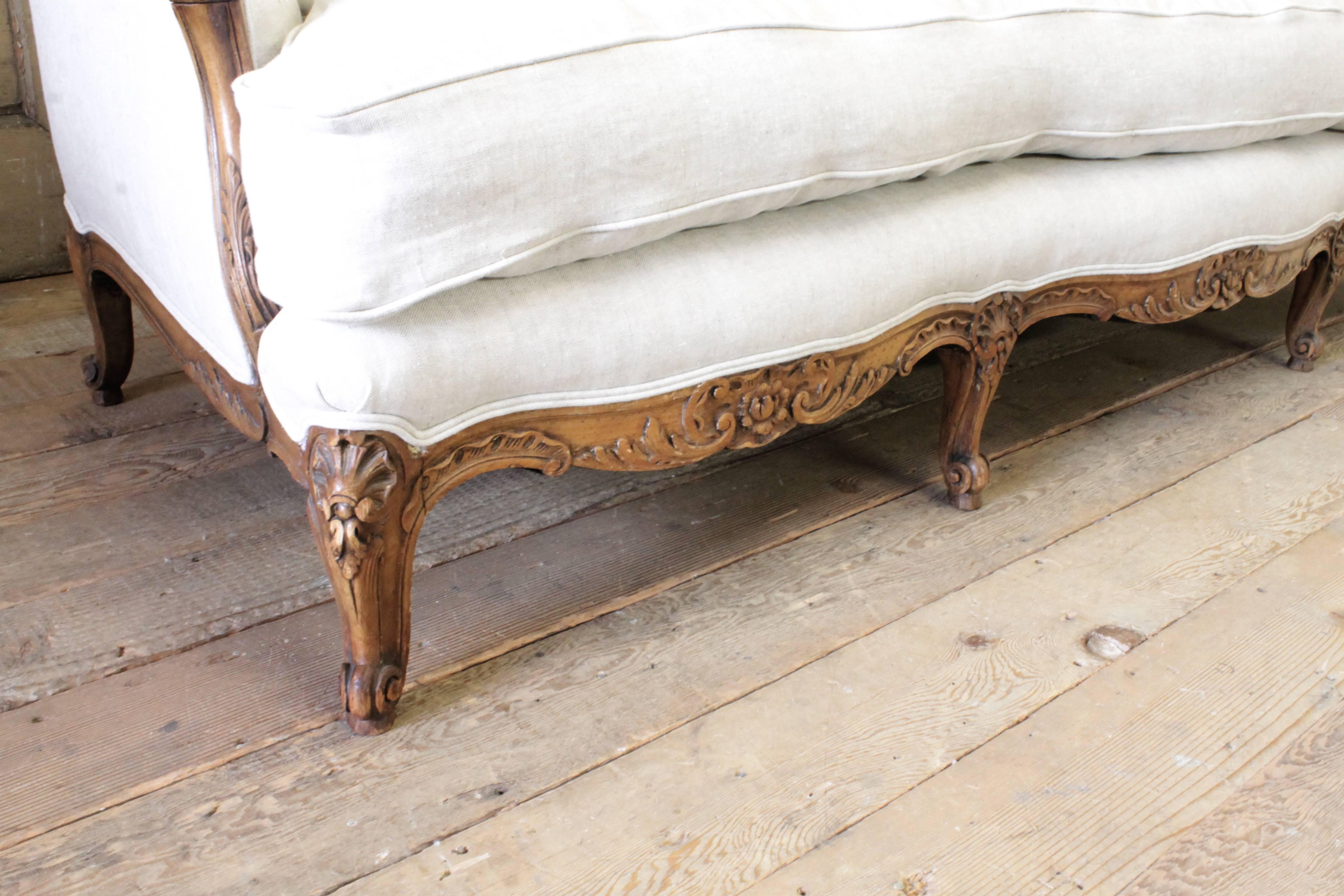 Classic Louis XV French Country style sofa, in a natural 15oz Belgian linen. The seat is a down wrapped, foam core. Very comfortable to sit in. Seat is slip covered, it can be removed to wash when needed. Legs are solid and sturdy.
