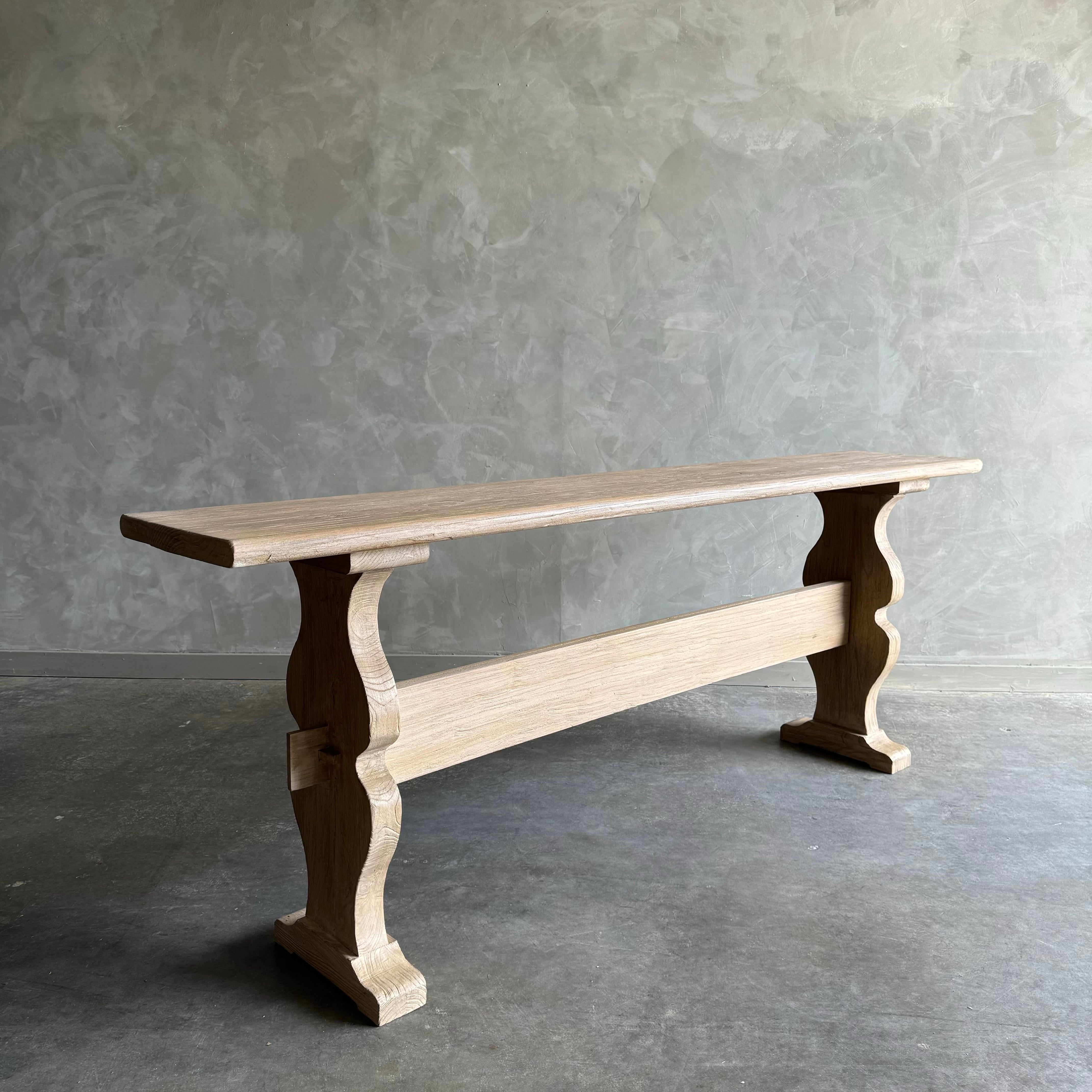 Reclaimed elm wood console that is beautifully crafted and serves as the perfect table for any space. Since this is made from vintage reclaimed materials, there may be some imperfections in the piece or grain of the wood. We like to call that