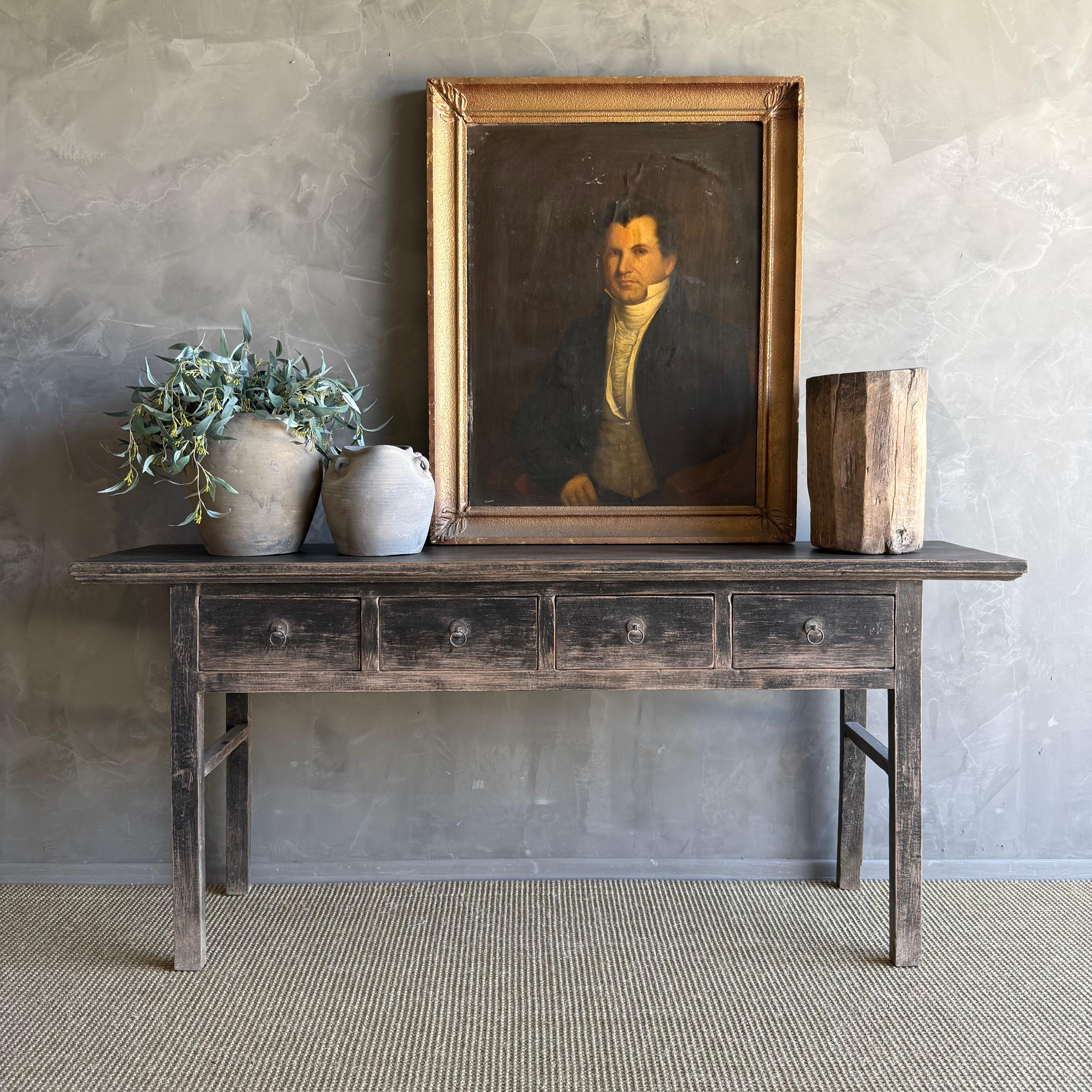 This charming vintage elm wood console is a one-of-a-kind piece with beautiful age and patina that adds character to any space. Its patina painted elm wood finish showcases the natural beauty of the wood, while the solid elm wood original hardware