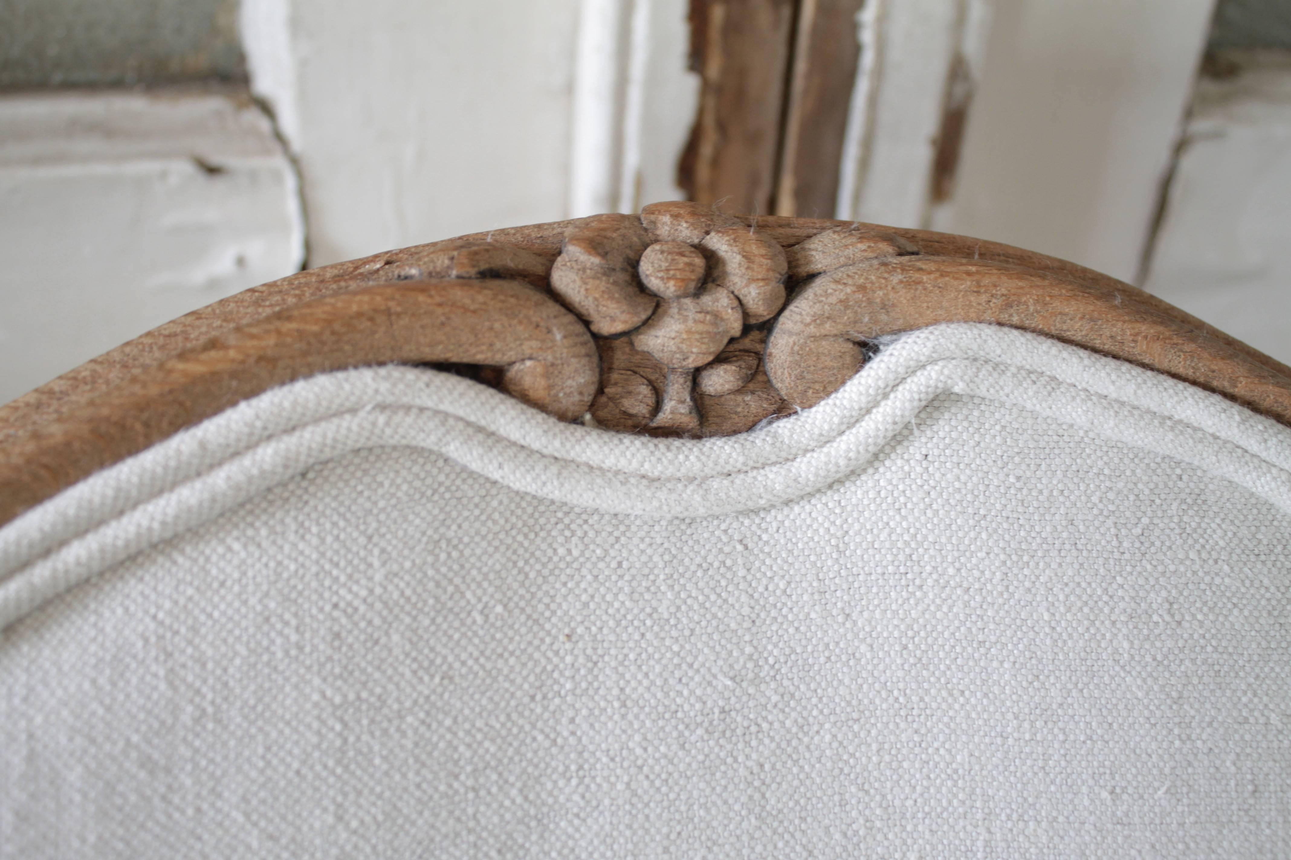 Gorgeous carved walnut dining chairs with a waxed finish. Traditional Louis XV style carved legs, and upholstered in a light oatmeal color linen. The linen is a 15oz 100% pure organic Belgian linen.
Each chair is very solid and sturdy, ready for