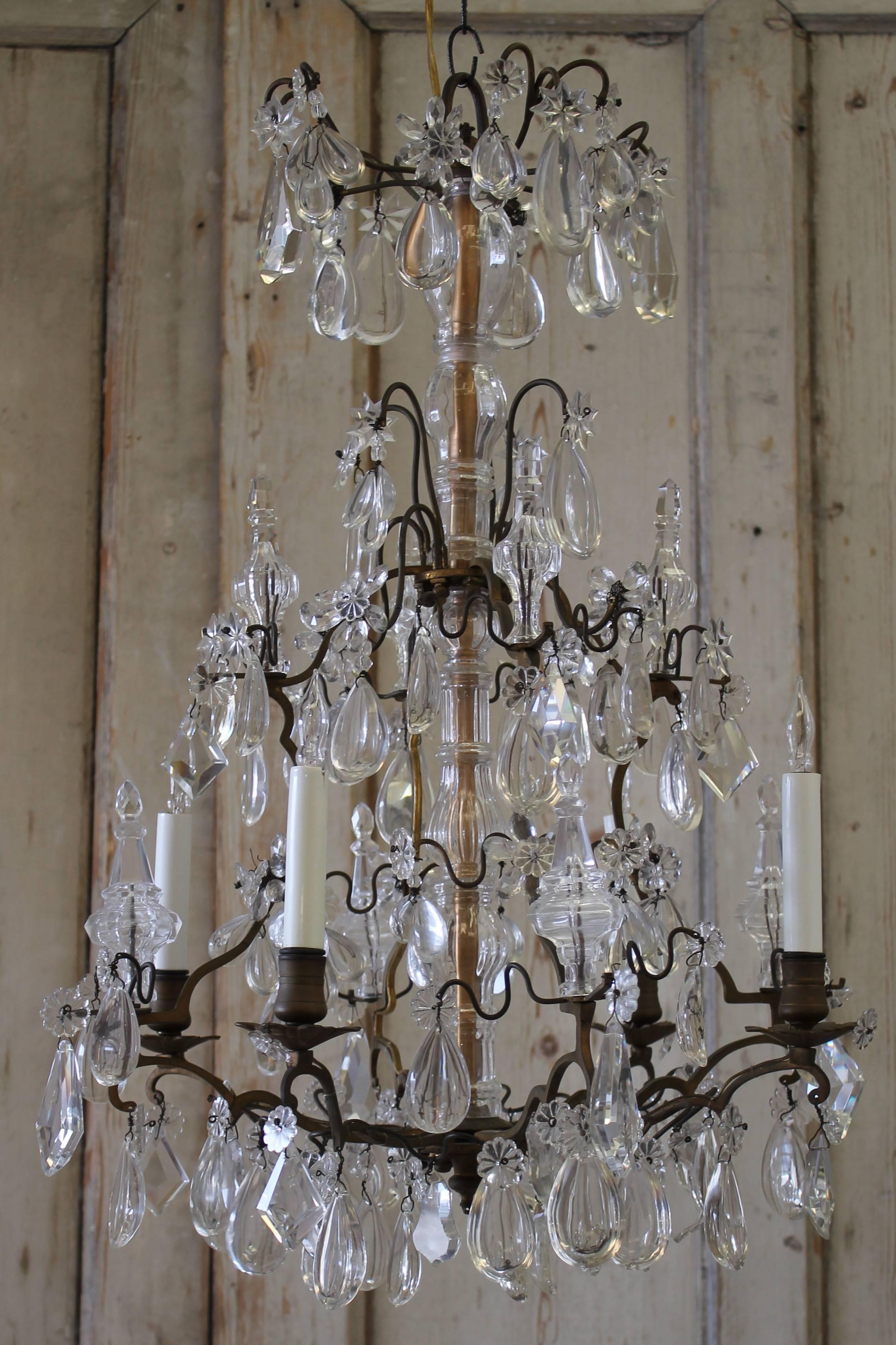 Pretty antique French five-light chandelier, with bronze frame, and usual crystals. Chandelier is ready to hang, ceiling medallion not included.
  