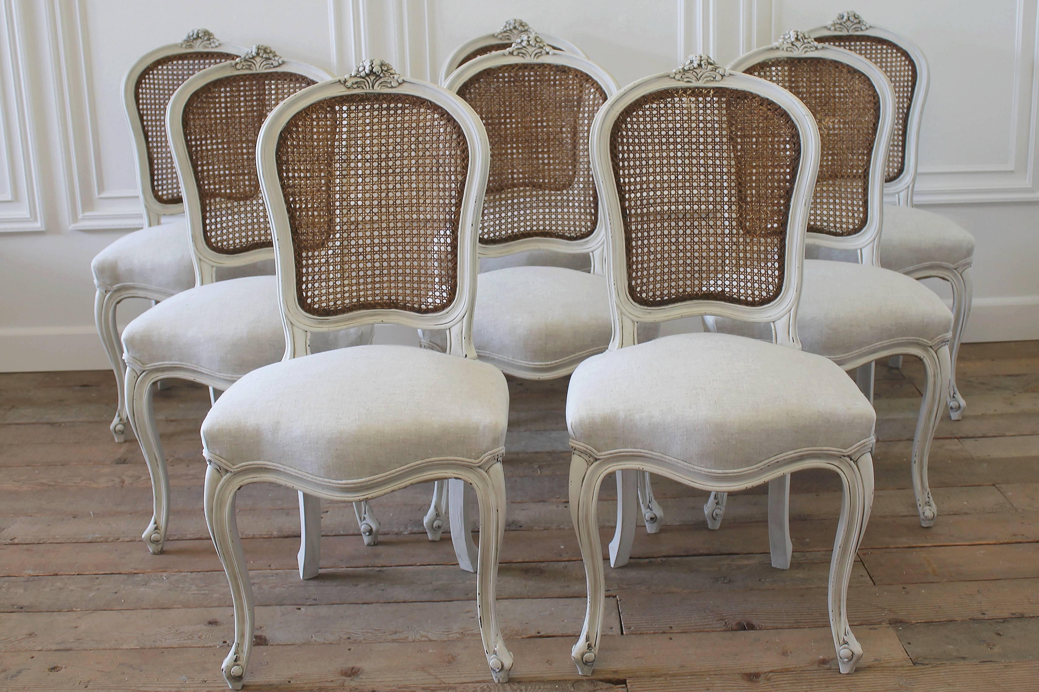 Beautiful set of dining chairs that have been painted in our signature oyster white, with an antique glazed finish. The cane backs have been left in their natural patina, and are in good condition with no breaks or holes.
The seats have been