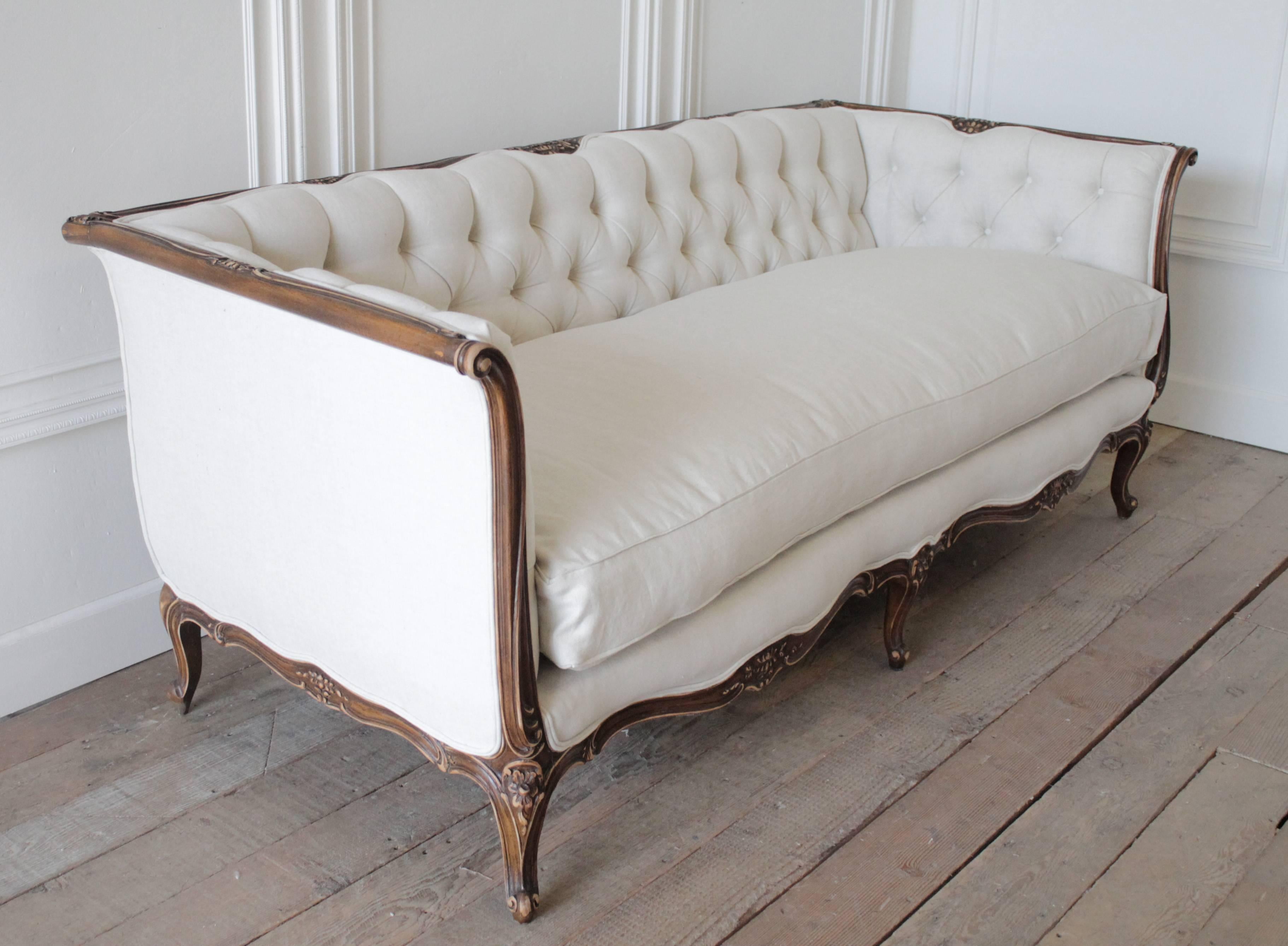 Beautiful Louis XV style sofa with solid wood carved frame, has been reupholstered in our 100% organic Belgian linen. The seat cushion is a new custom bench style, down wrapped cloud cushion. The seat cushion cover does have a zipper to remove if