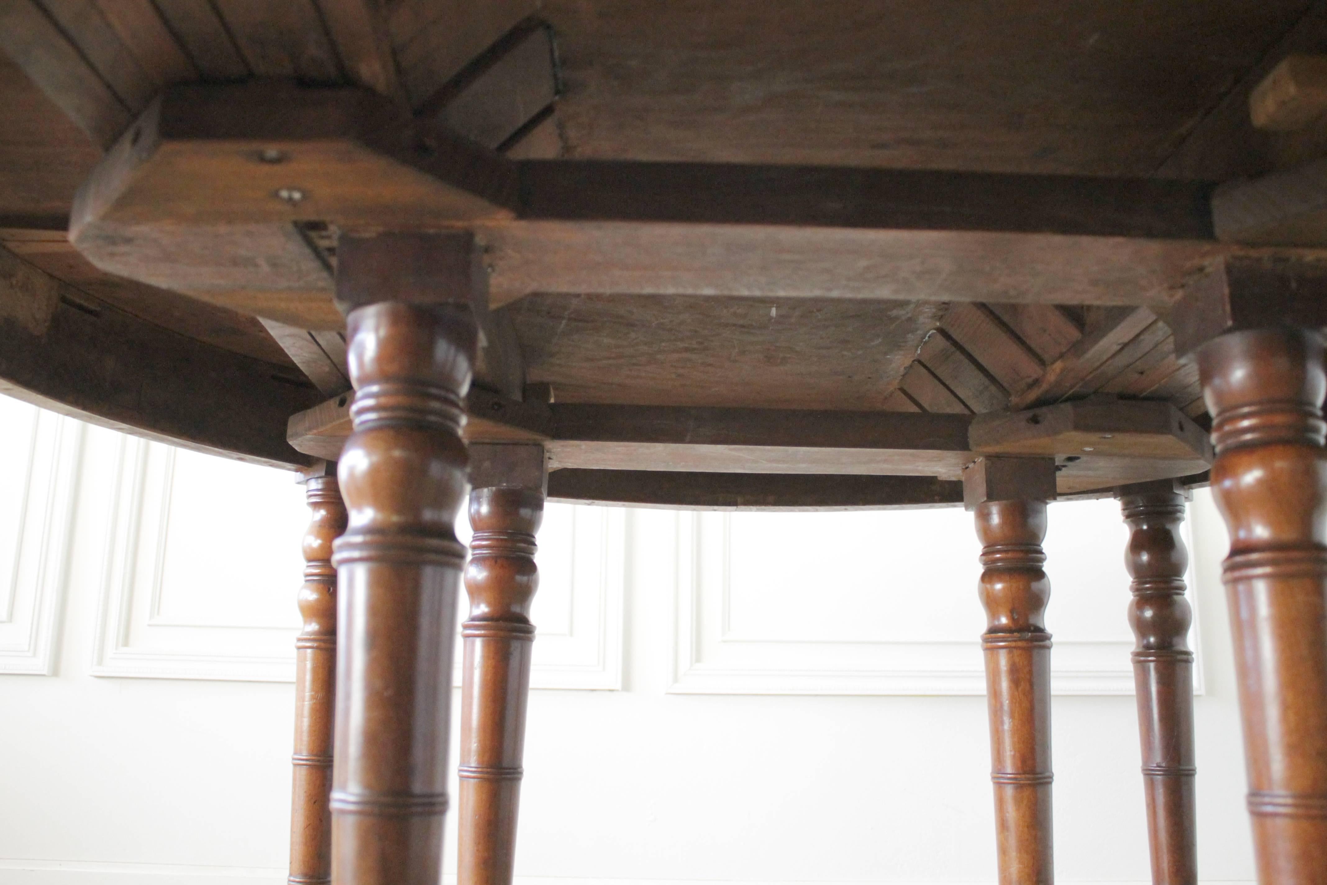 French Early 19th Century Dining or Entry Table with eight Legs and Caster Wheels