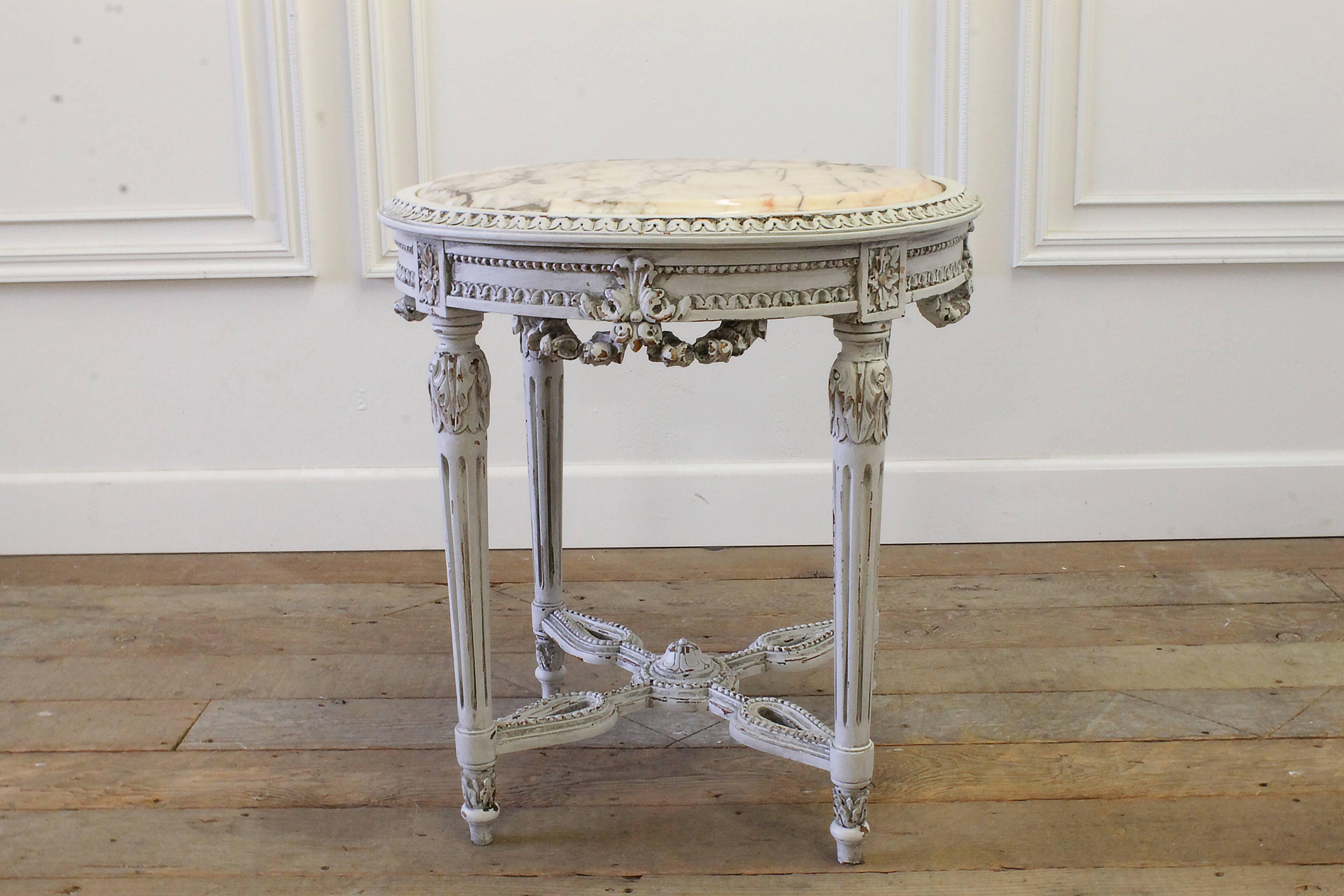 Beautiful antique table in the Louis XVI style, has a creamy and soft pink marble top, with rust colored veins. Marble looks to be original and may have a petite flaw here or there.
Measures: 26