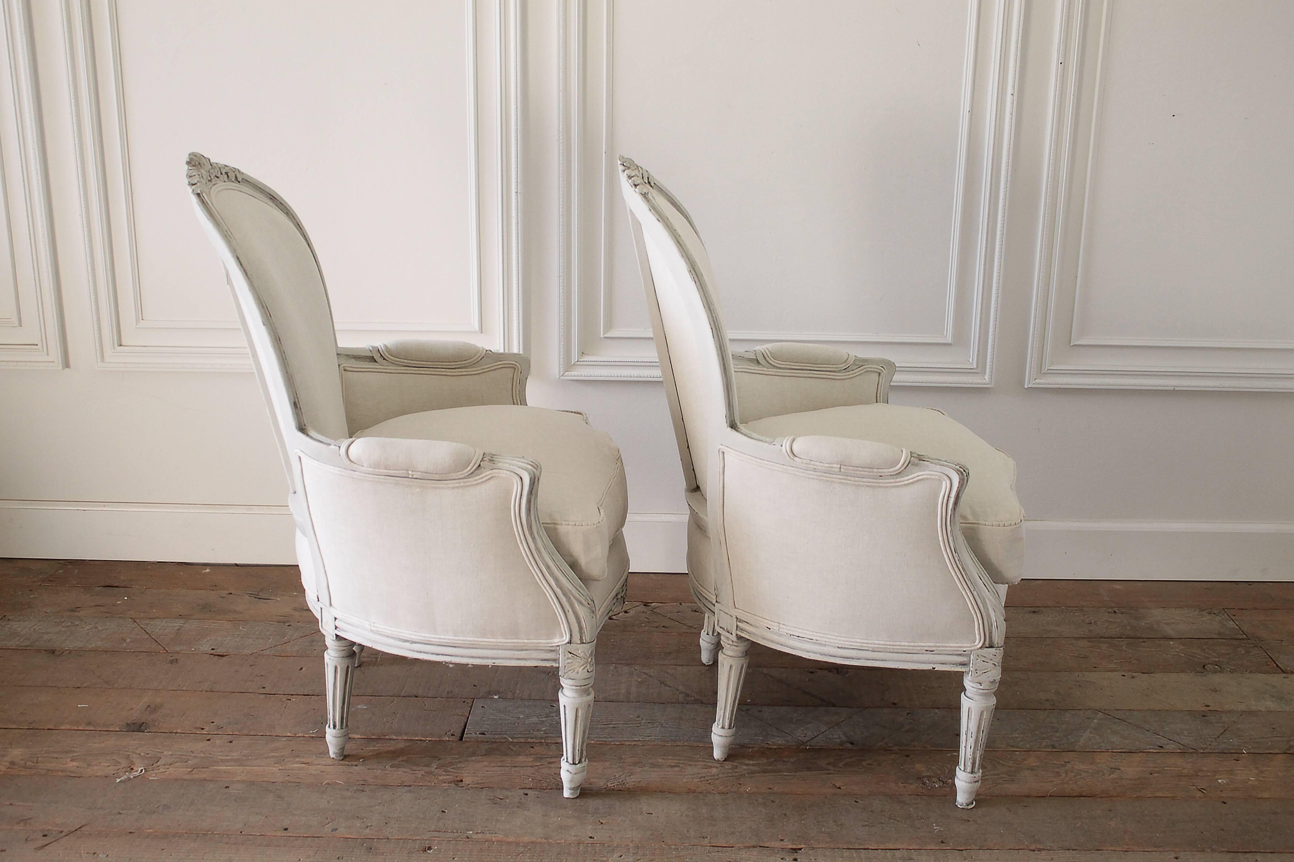 20th Century Pair of Painted and Upholstered Belgian Linen Louis XVI Style Bergere Chairs