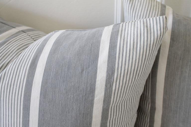 Pair of Antique French Ticking Pillows with Down Feather Inserts at 1stdibs