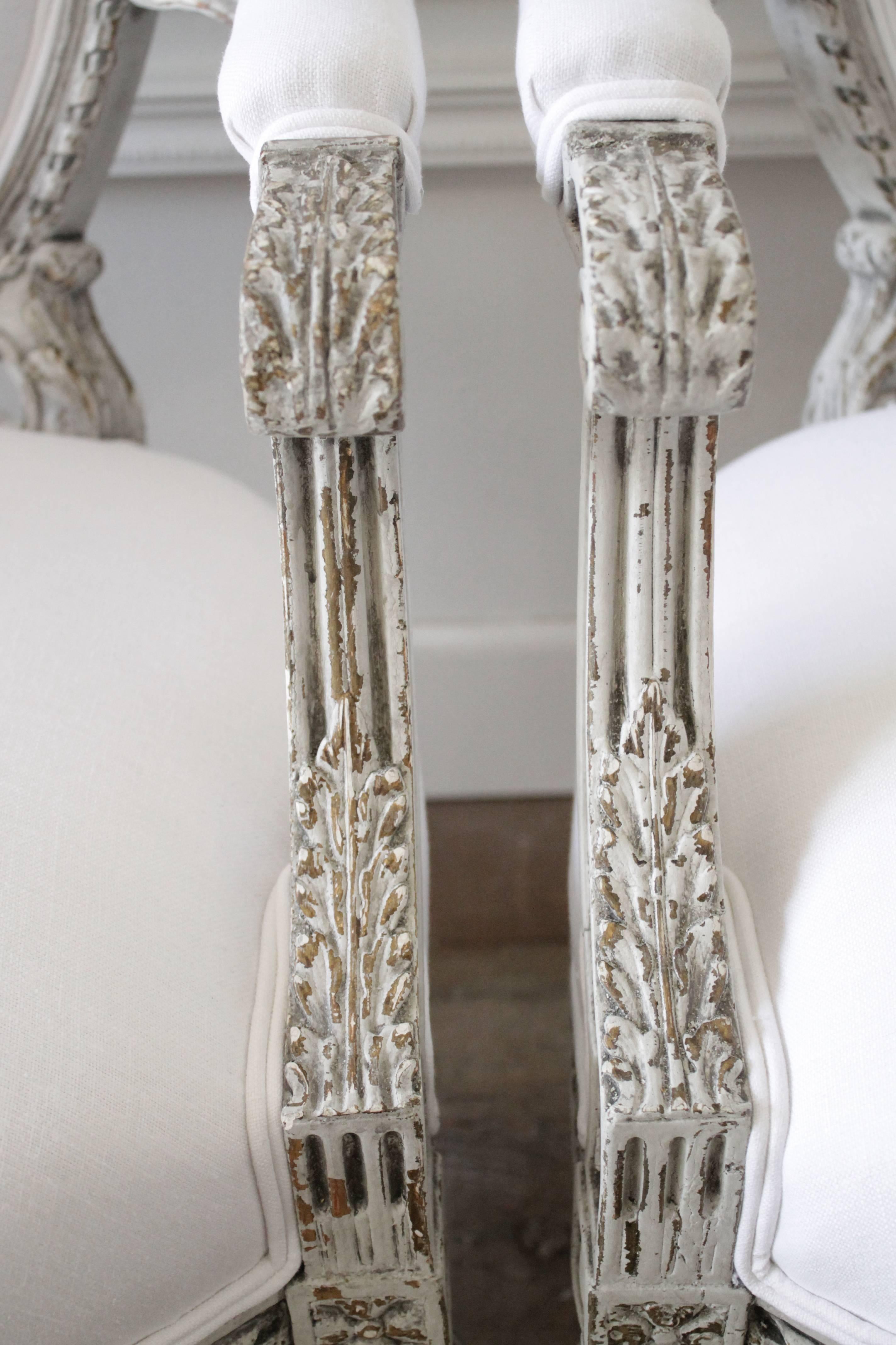Upholstery Four Painted and White Linen Upholstered Louis XVI Ribbon Carved Armchairs