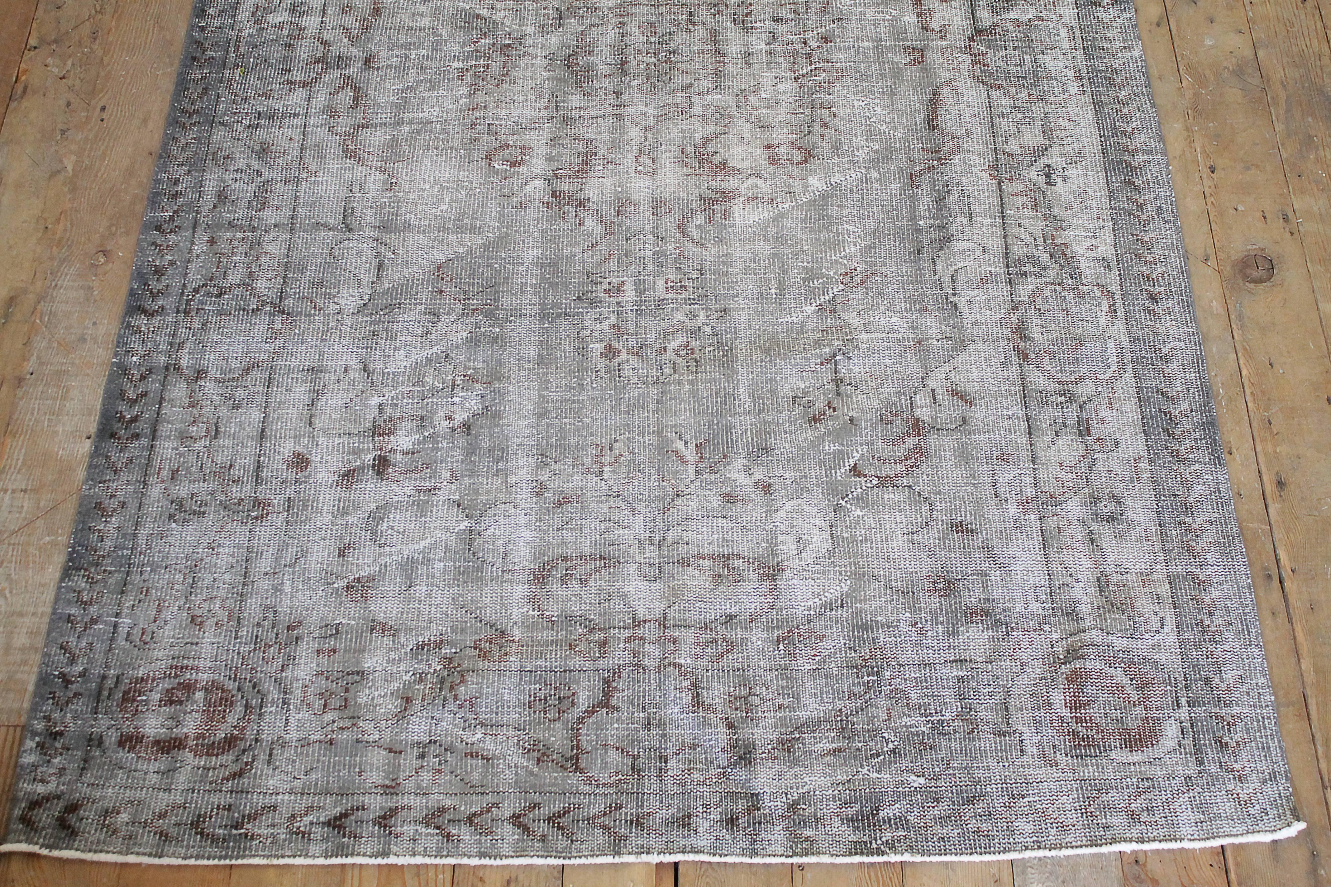 Gorgeous faded indigo, grey and rust colors running through out. Wool hand-knotted rug from the 1940s. Measures: 68
