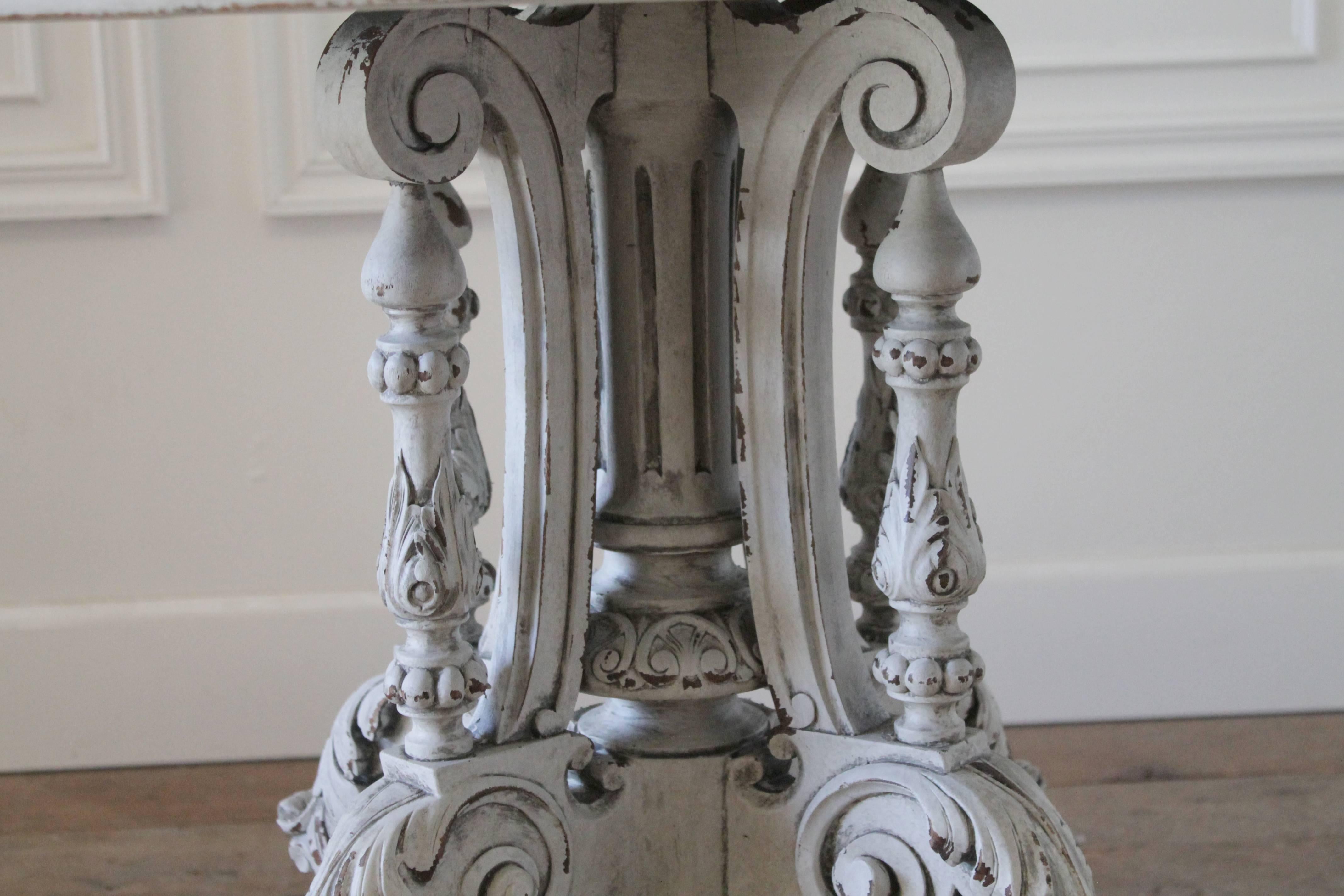 Oval top center table with highly carved pedestal base. Finished in our custom oyster white with distressed edges, and a hand glazed finish.
tabletop is sturdy, with subtle distressed edges. As shown in photos top has a slight