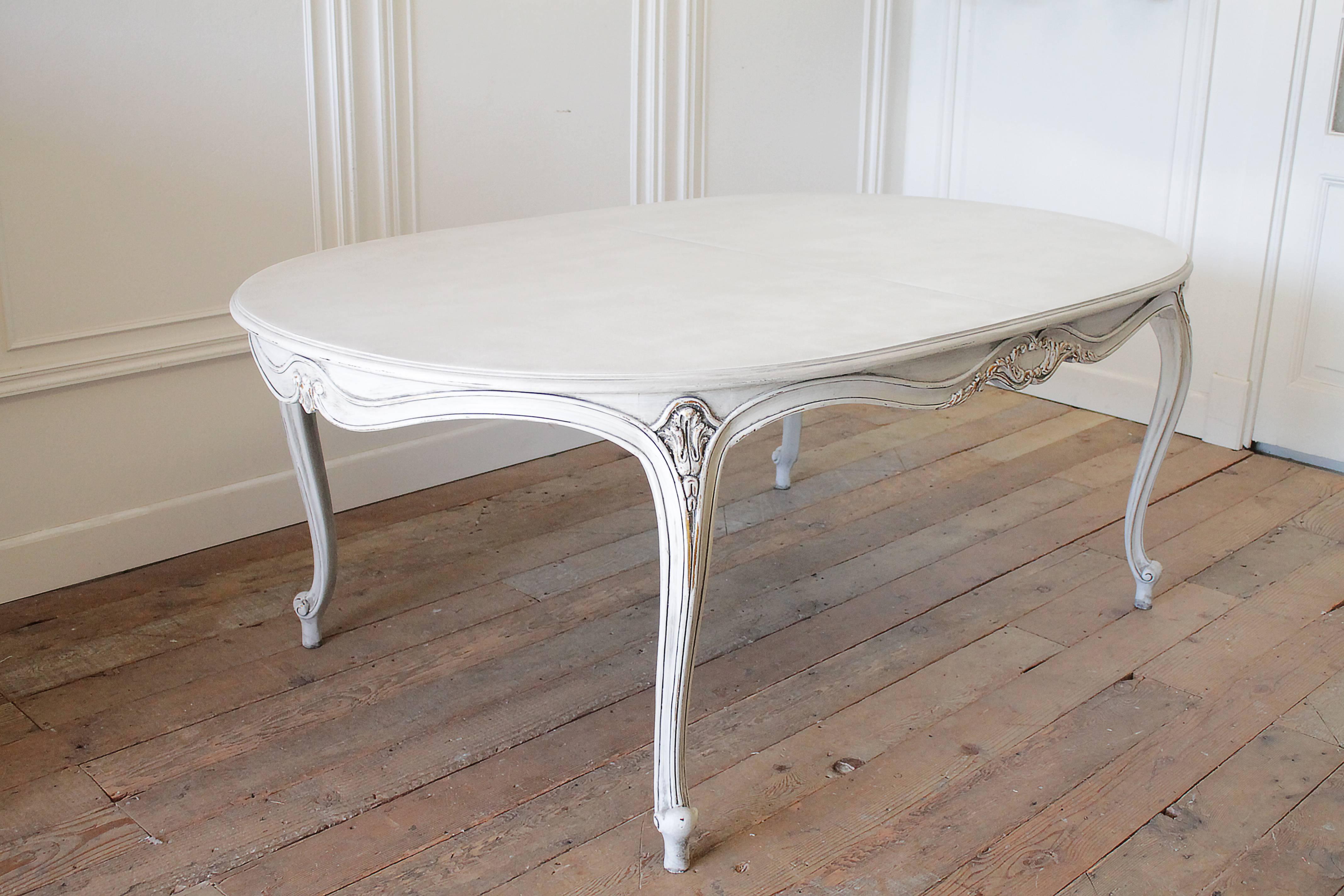 This vintage dining table is beautifully made of high quality solid wood by Karges Furniture. We have custom finished this piece in our antique oyster white, which is a soft white, with distressing, and a hand glazed finish which tints this in a