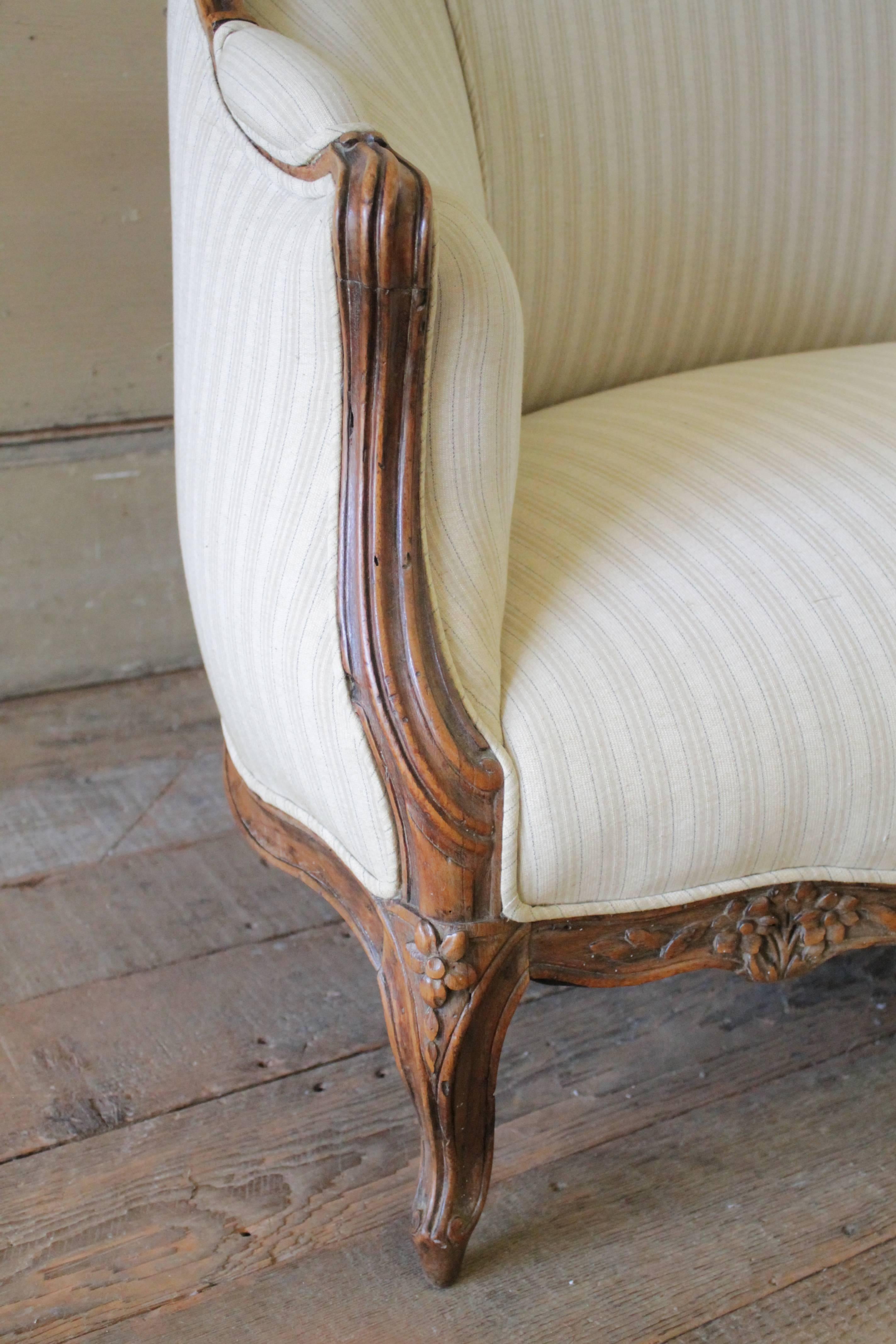 19th Century Walnut Rose Carved Settee Upholstered in Stripe Linen 1