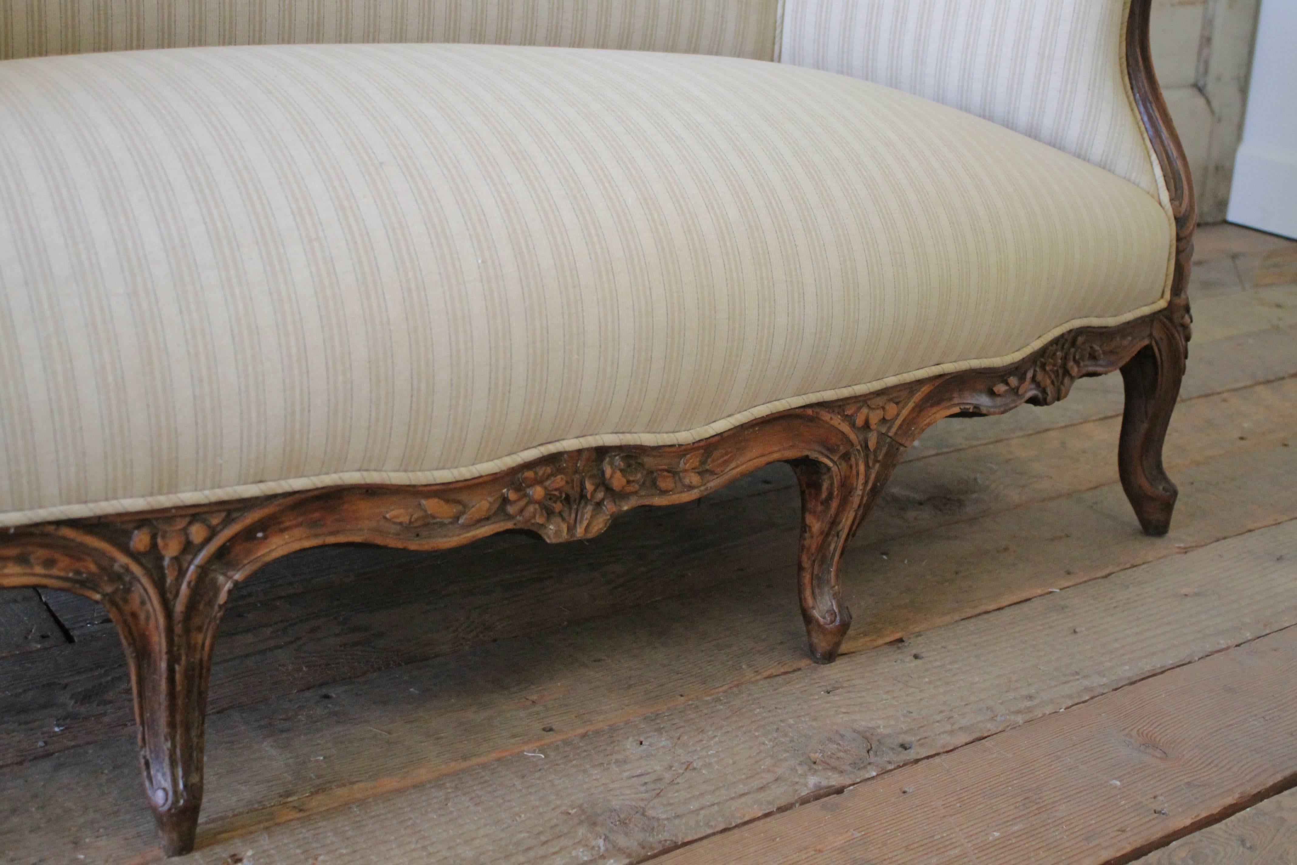 19th Century Walnut Rose Carved Settee Upholstered in Stripe Linen 2