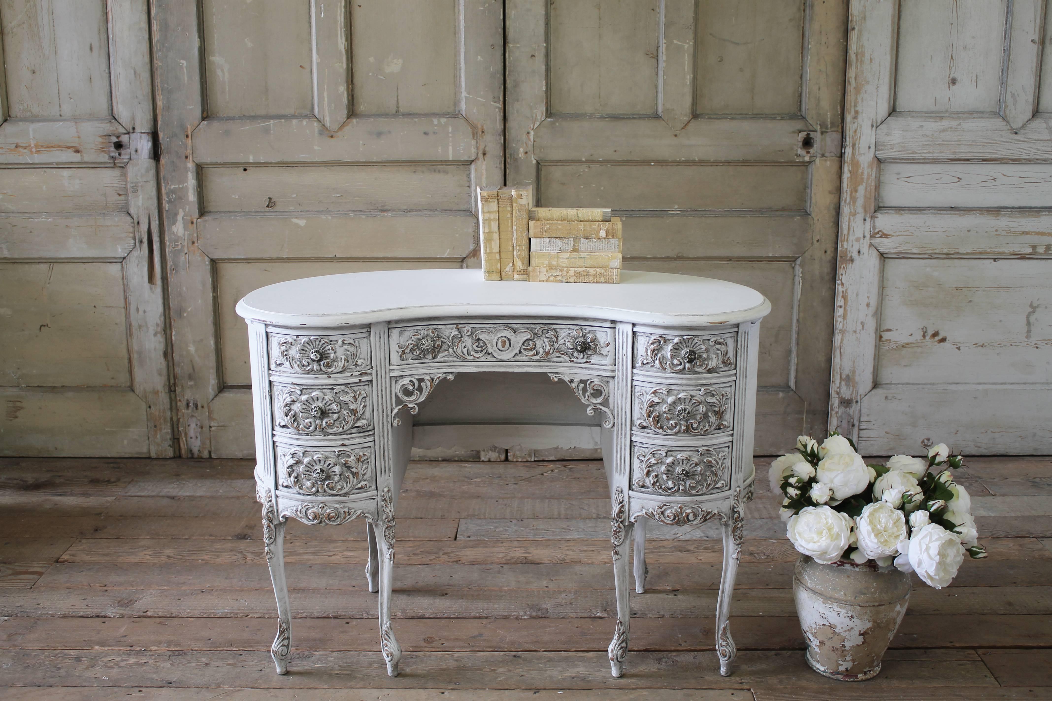 Beautiful vanity has been painted in our oyster white, with an antique distressed finish. Heavily carved with scrolls and floral motifs. Original metal drawer knobs, and dovetail finish. Legs are strong and sturdy, ready for daily use.
Finished on