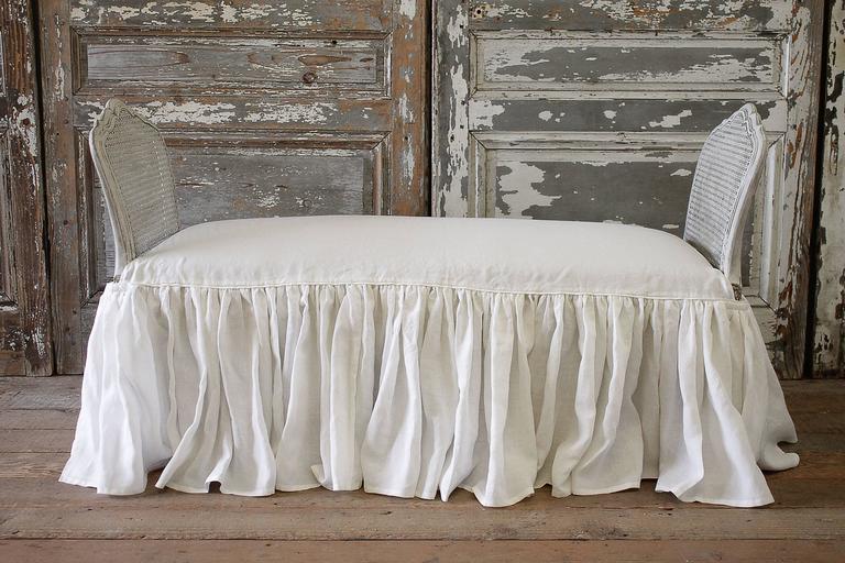Vintage Cane Bench with Custom Linen Ruffle Slip Cover at 1stDibs