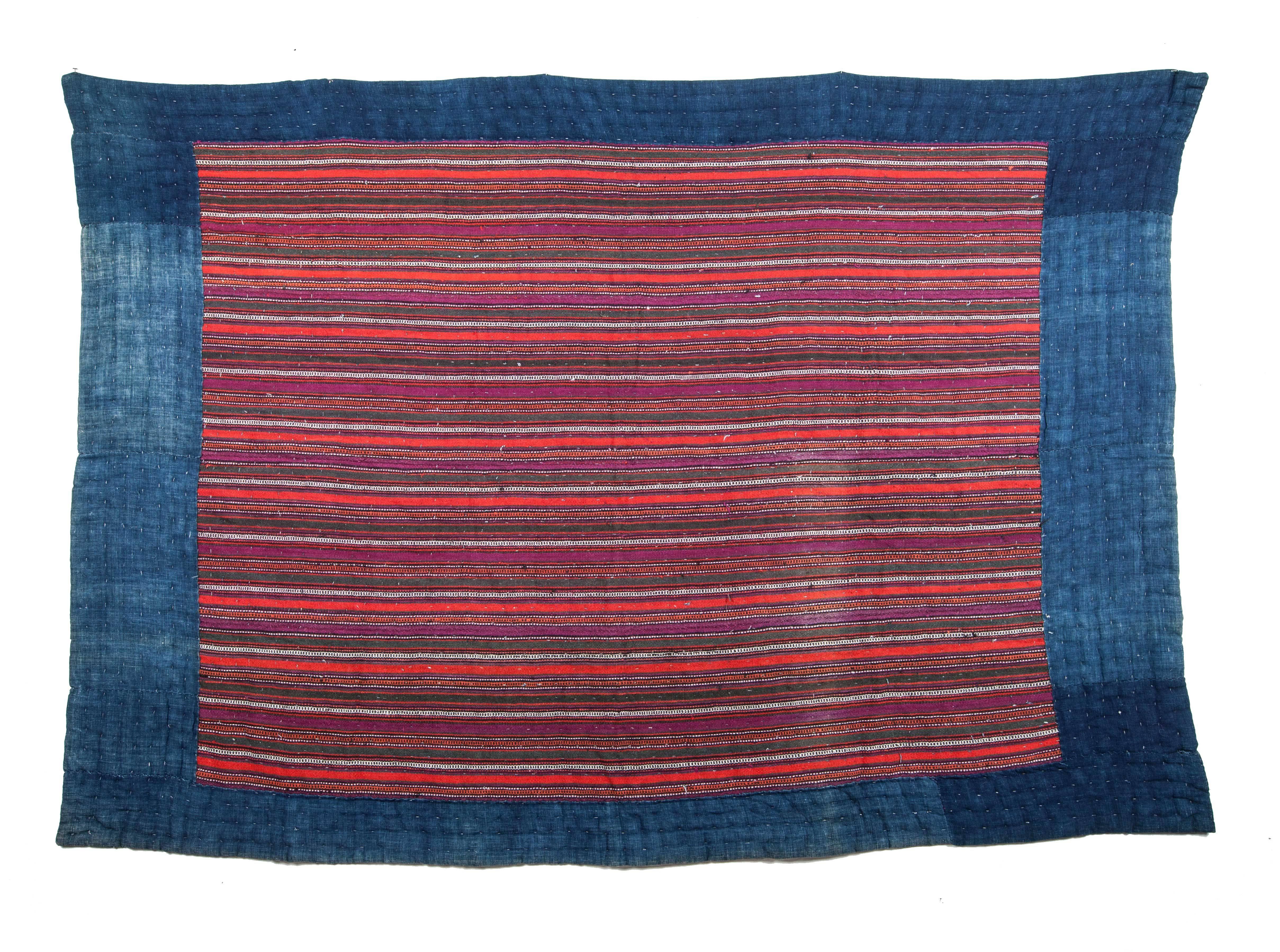 An ethnographic weaving from Northern Persia. The front of the piece is made of wool jajim and the reverse is indigo colored cotton. It is heavily padded and there is a layer of wool in between the surface and the backing. 
For me it is more about