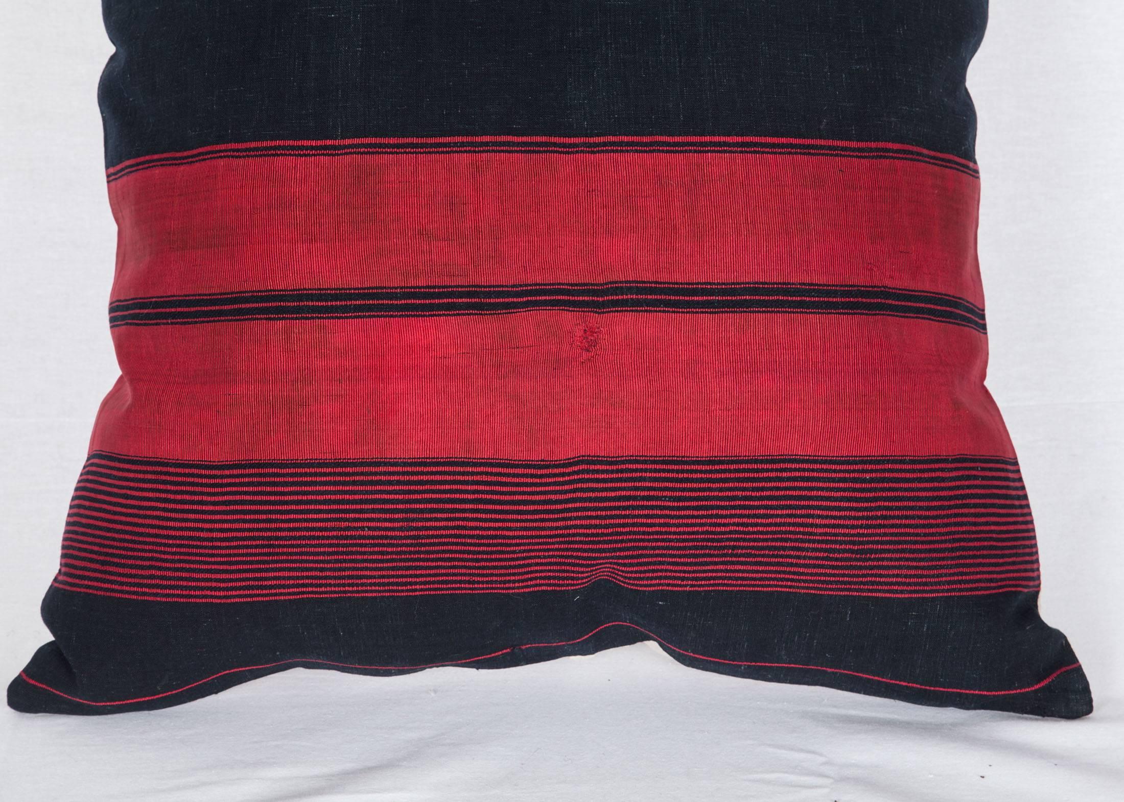 The pillow is made out of a late 19th-early 20th century Afghan Waziri Shawl. Red and indigo blue. It does not come with an insert but it comes with a bag made to the size and out of cotton to accommodate the filling. The backing is made of linen. 