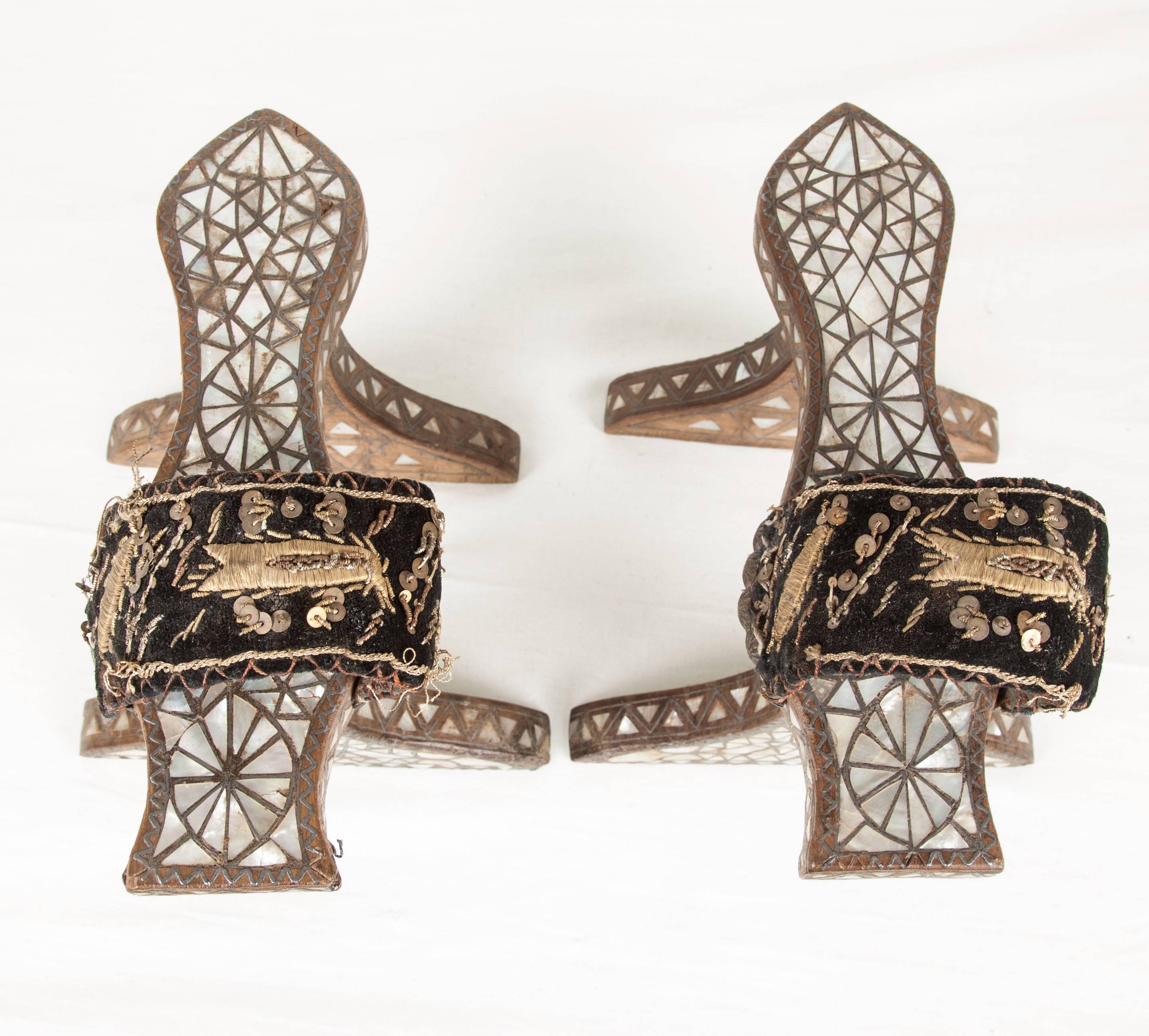 The base of the clogs (slippers) or nalin is carved out of wood (walnut wood) and decorated with mother-of-pearl. The strap is embroidered in silver thread on velvet. The height is 6.2''/16 cm, The length is 9.4'' /24 cm.

These items are one of