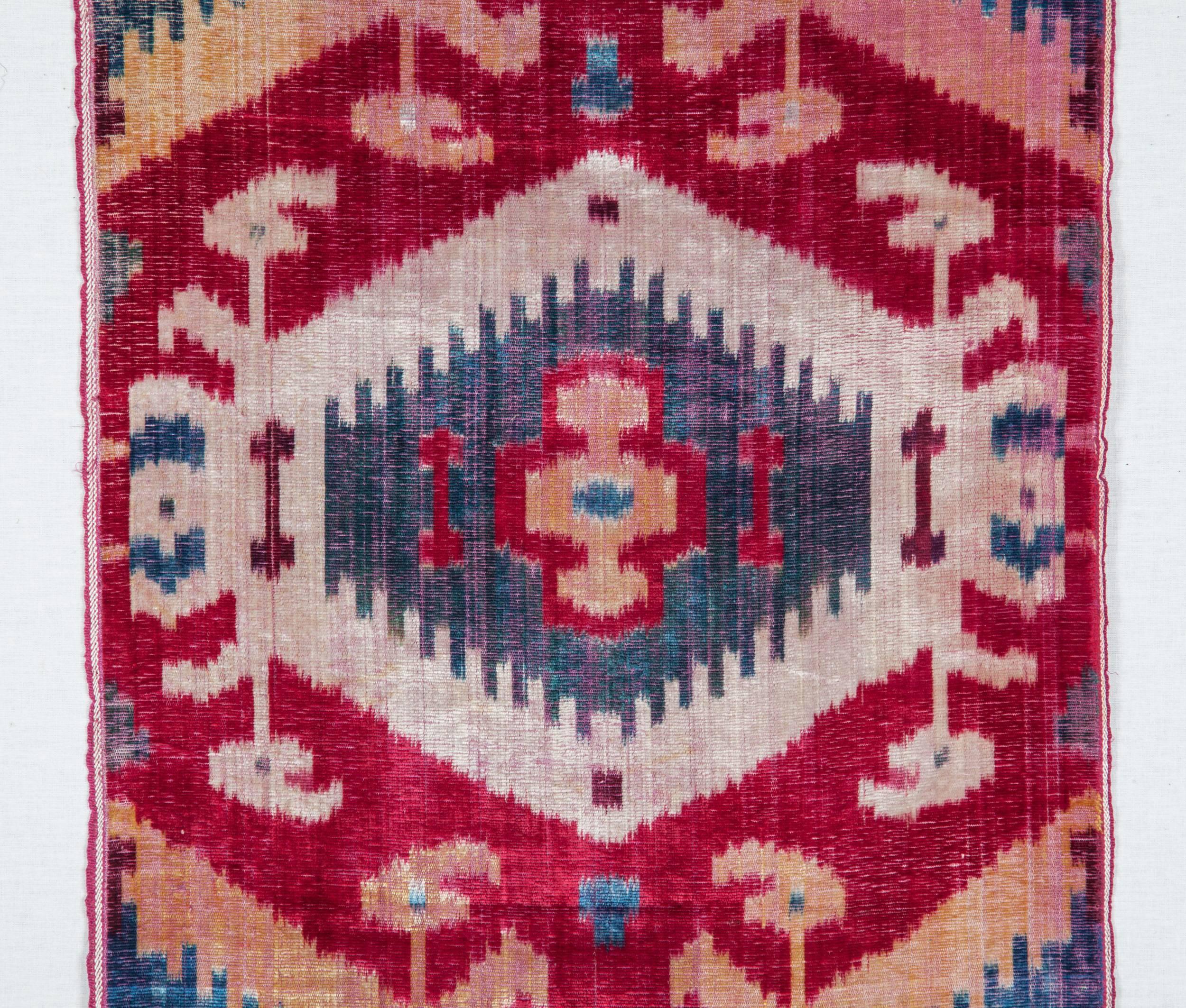Velvet ikat technically is a very complicated way of making a textile. This panel has a rarer design in the whole design pool of silk velvet ikats from Uzbekistan.
The surface is slightly worn out but the design elements still read pretty
