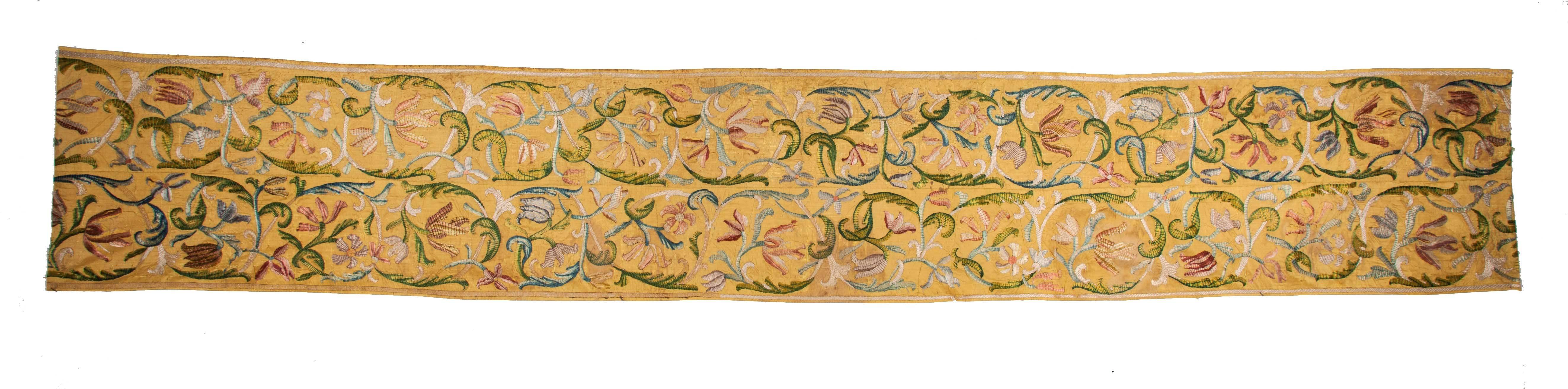 embroidered in polychrome silk floss, on a silk background, 