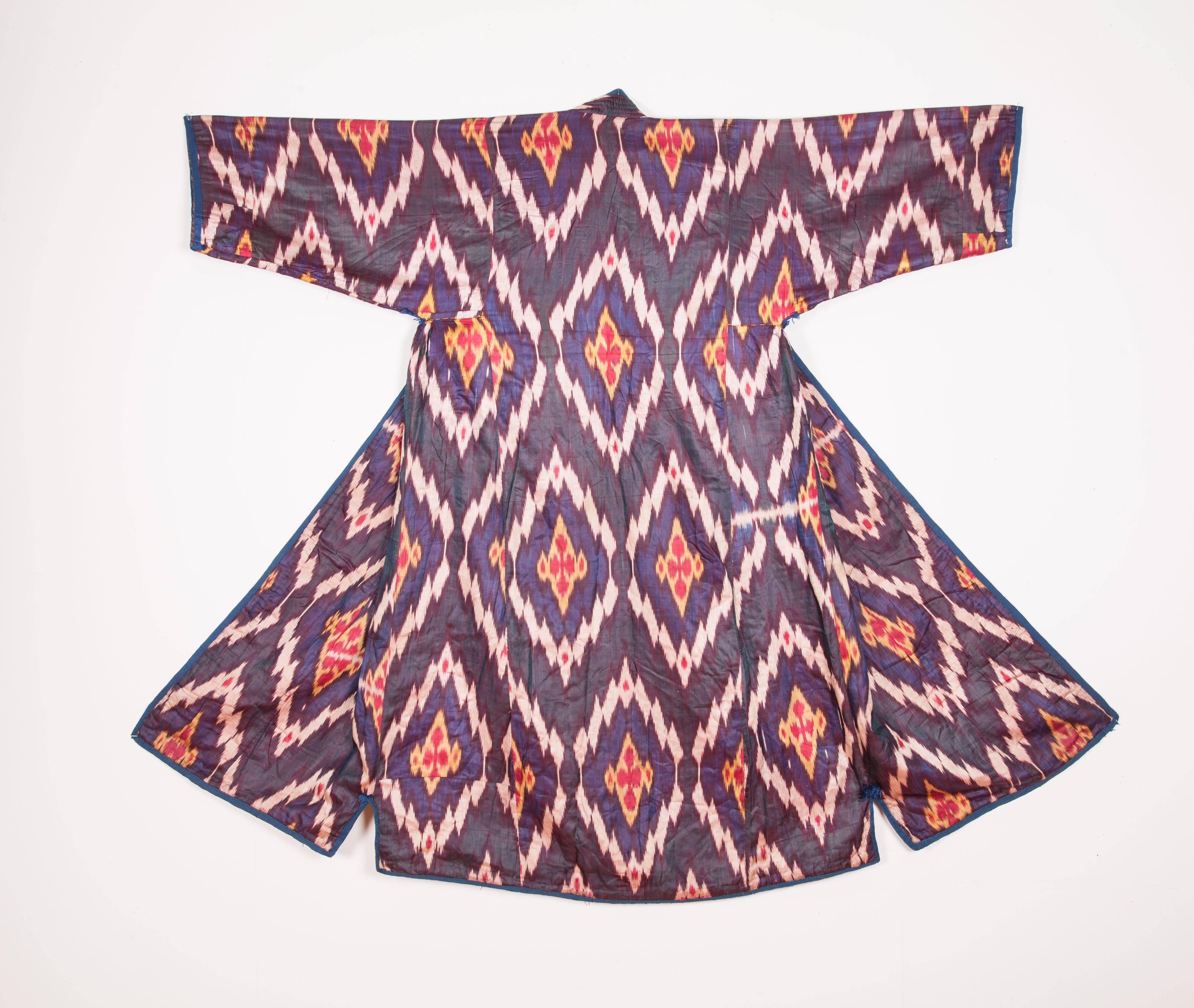 Very soft silk 19th century chapan. Measures: Neck to hem 51''.
Sleeve to sleeve: 51''.