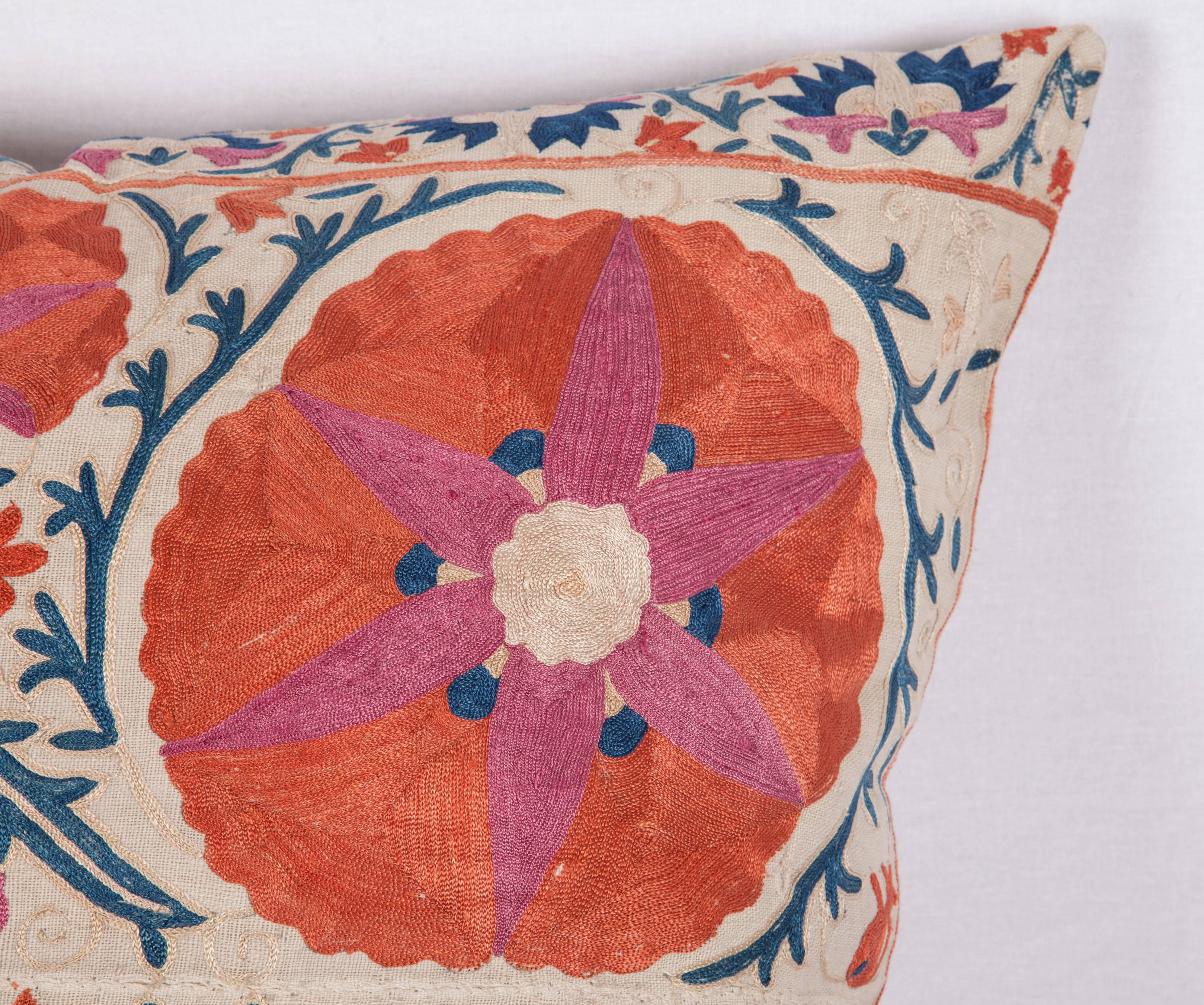 The pillow is made out of a mid-19th century, Uzbek silk Suzani fragment. It does not come with an insert but it comes with a bag made to the size and out of cotton to accommodate the filling. The backing is made of linen. Please note filling is not