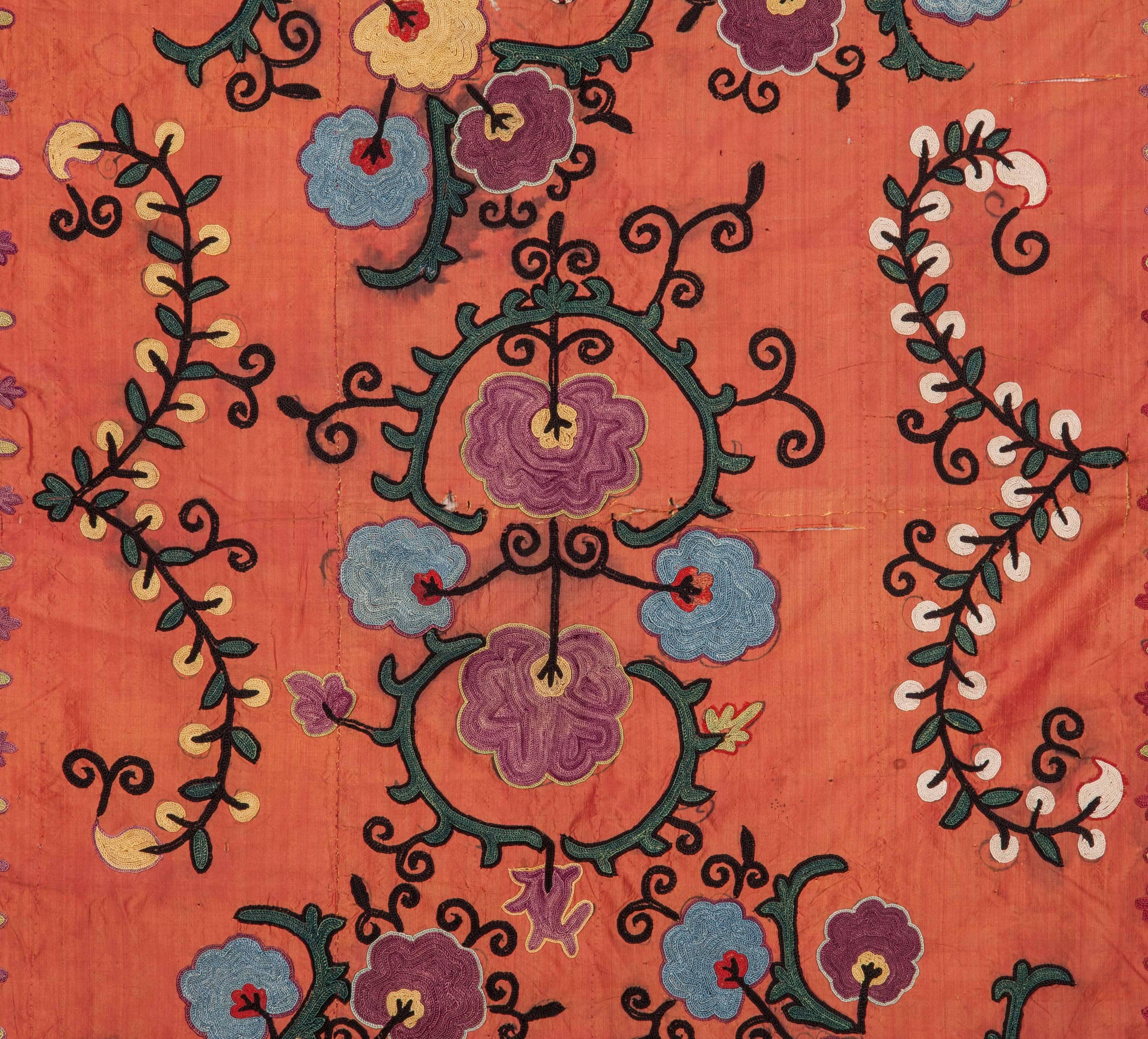A nim suzani embroidered on a fine silk background with Russian roller print original lining.