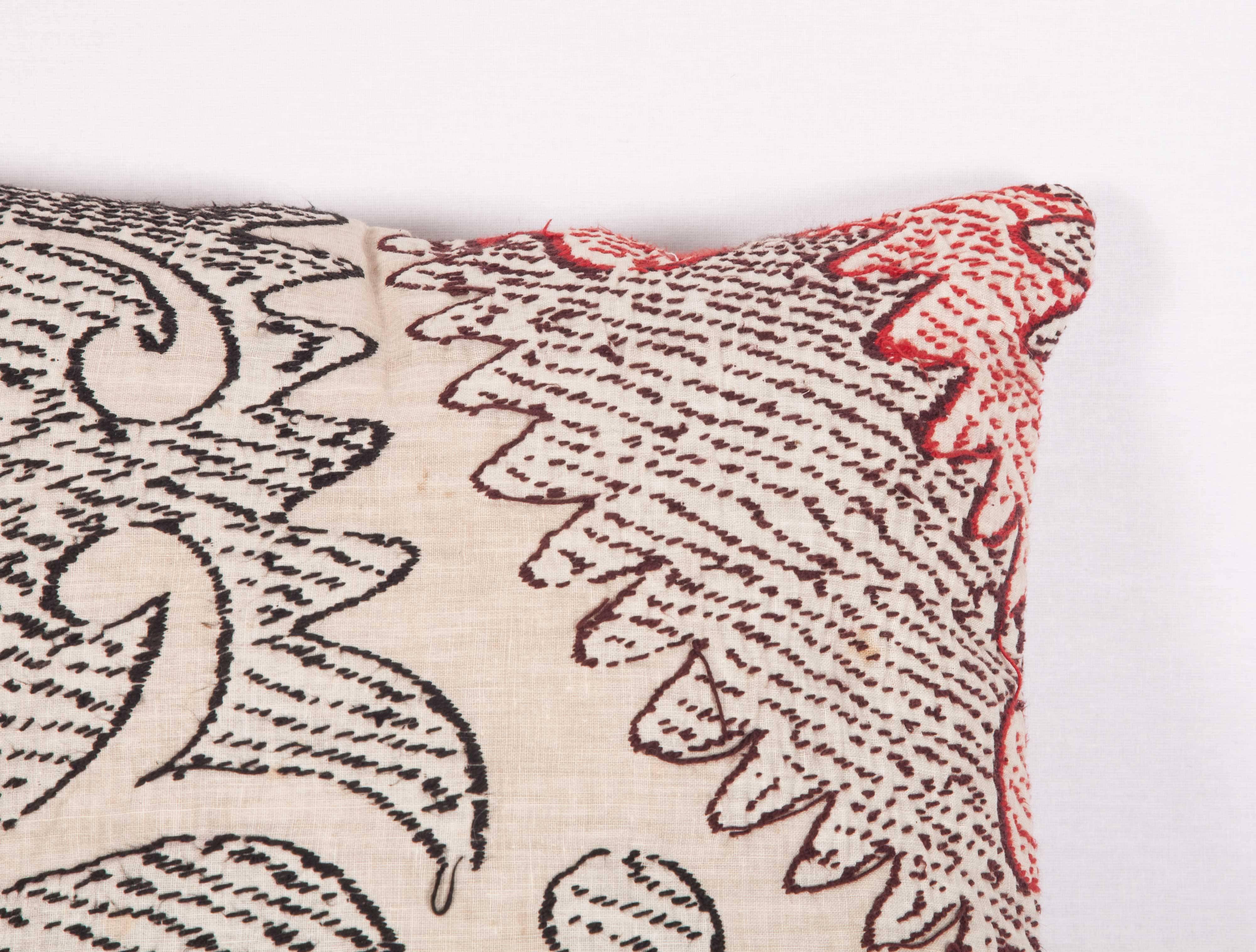 The pillow is made out of a mid-20 century, Uzbek Samarkand Suzani fragment. (I liked the reverse of this piece so that is what i used as the front of the pillow)
It does not come with an insert but it comes with a bag made to the size and out of