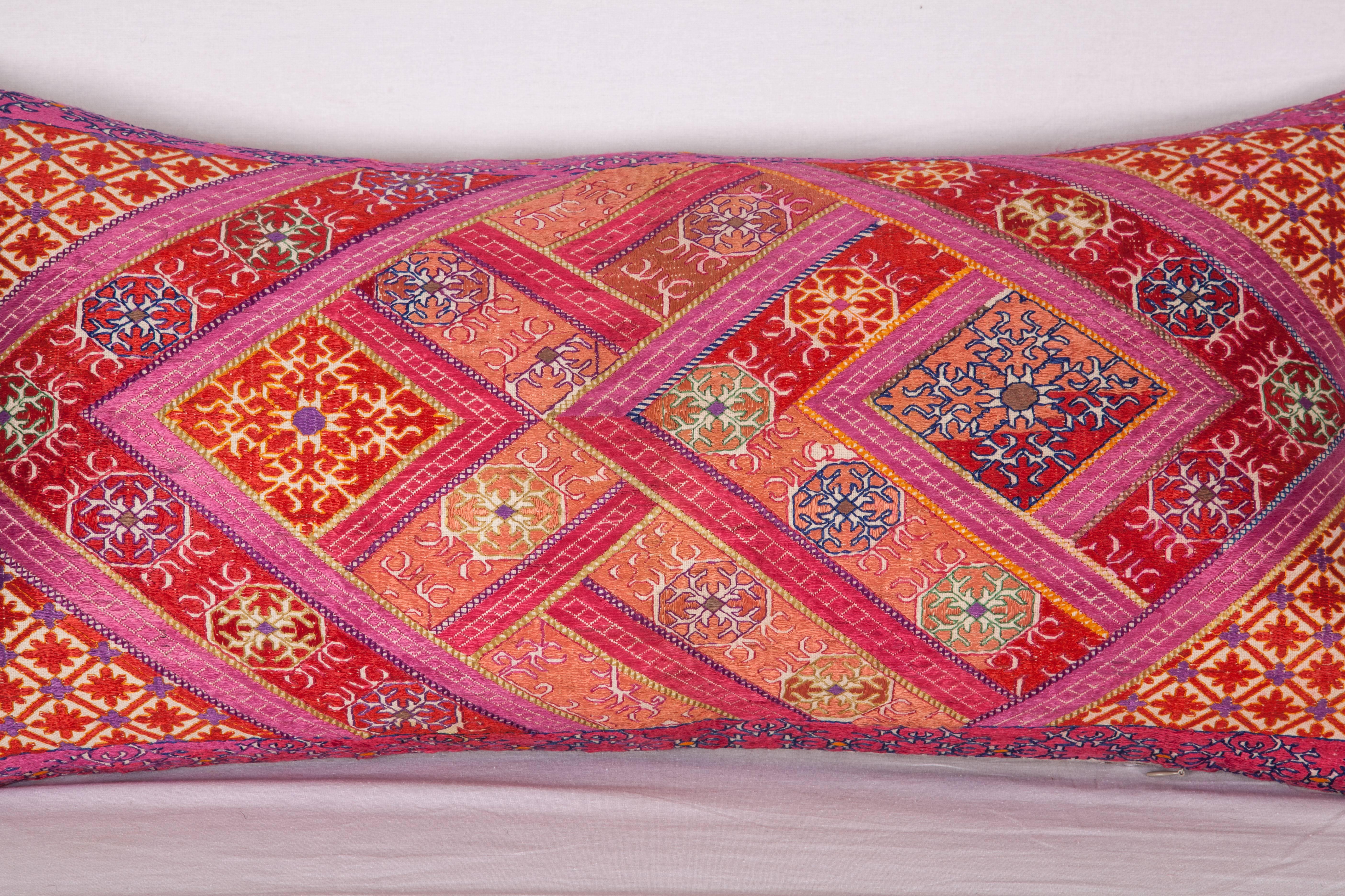 Silk embroidery on cotton fabric from Swat Valley of Pakistan. It does not come with an insert but it comes with a bag made to the size and out of cotton to accommodate the filling. The backing is made of linen. Please note filling is not provided.