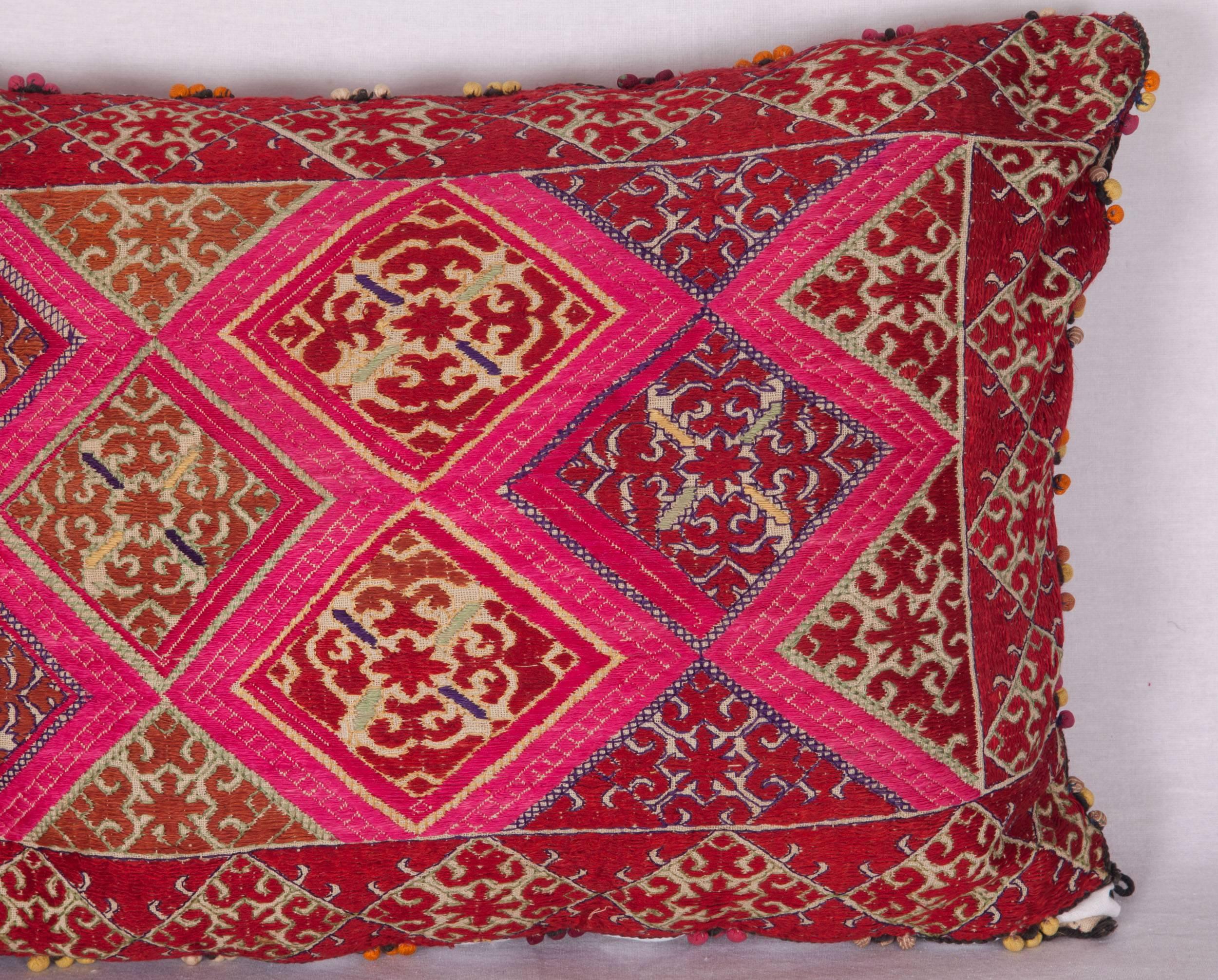 Silk embroidery on cotton fabric from Swat Valley of Pakistan. It does not come with an insert but it comes with a bag made to the size and out of cotton to accommodate the filling. The backing is made of linen. Please note filling is not provided.