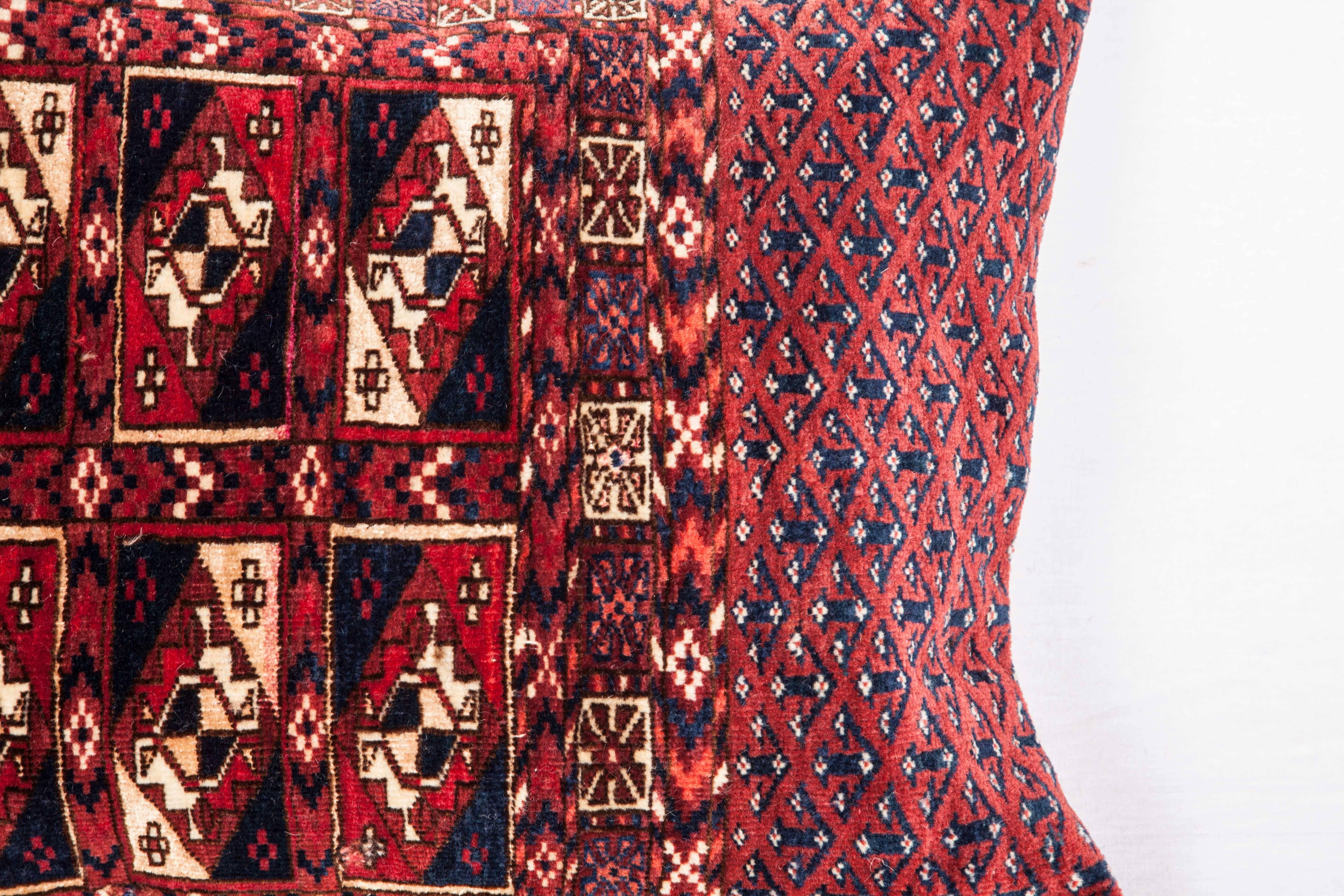 The pillow is made out of a late 19th century, Turkmen Tekke Chuval (storage bag). It has silk highlights. It does not come with an insert but it comes with a bag made to the size and out of cotton to accommodate the filling. The backing is made of