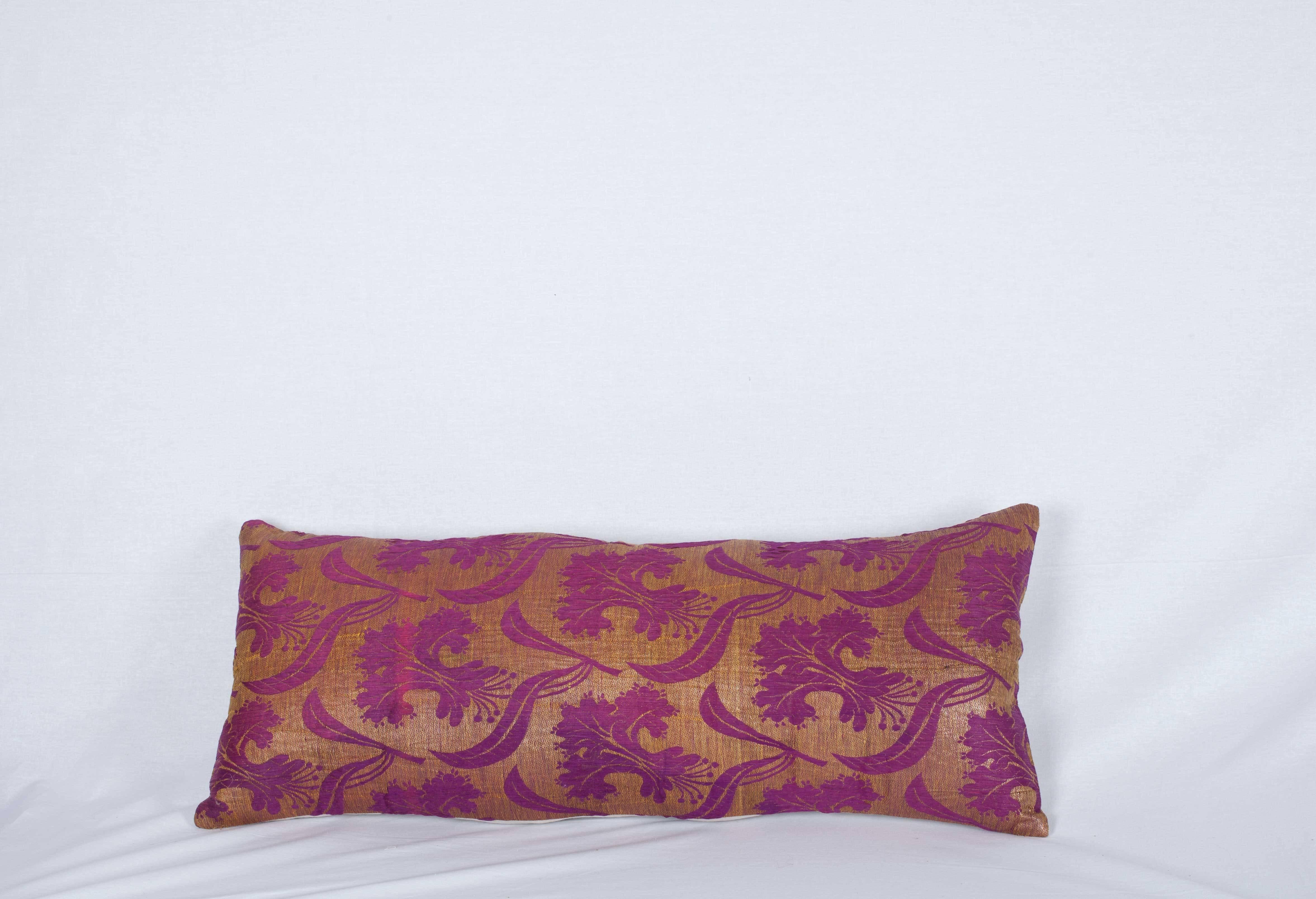 The pillow is made out of a late 19th ottoman Turkish silk brocade.
 It does not come with an insert but it comes with a bag made to the size and out of cotton to accommodate the filling.
 The backing is made of linen.
 
 Please note filling is
