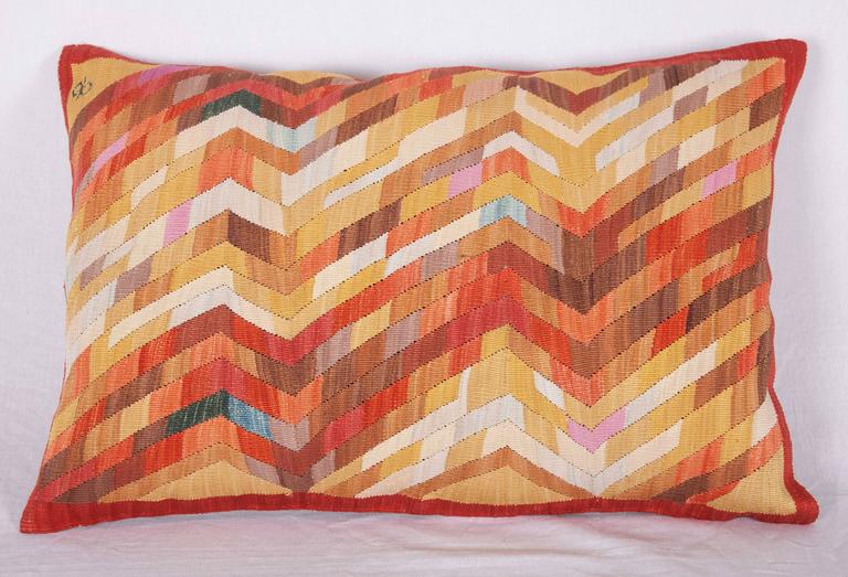 A pair of pillows made out of small weavings, woven by Kazim Musa Basaran.
The silk is colored with natural dyes.
The backing is pure linen and it is hand-stitched on the Kilim, if removed the Kilim will be intact.
 