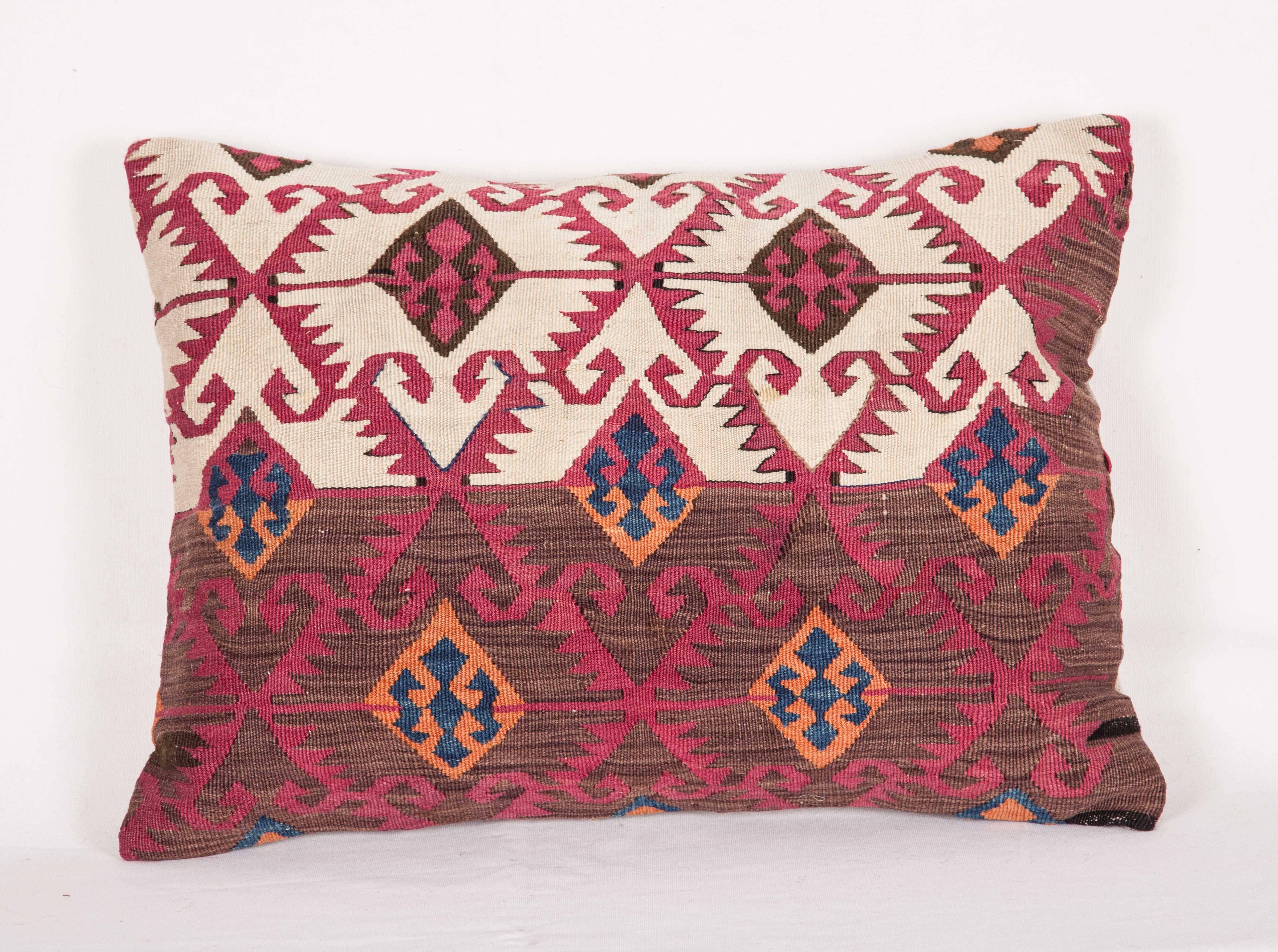 The pillows are made out of a late 19th century, Anatolian Kilim fragment. It does not come with an insert but it comes with a bag made to the size and out of cotton to accommodate the filling. The backing is made of linen. Please note filling is