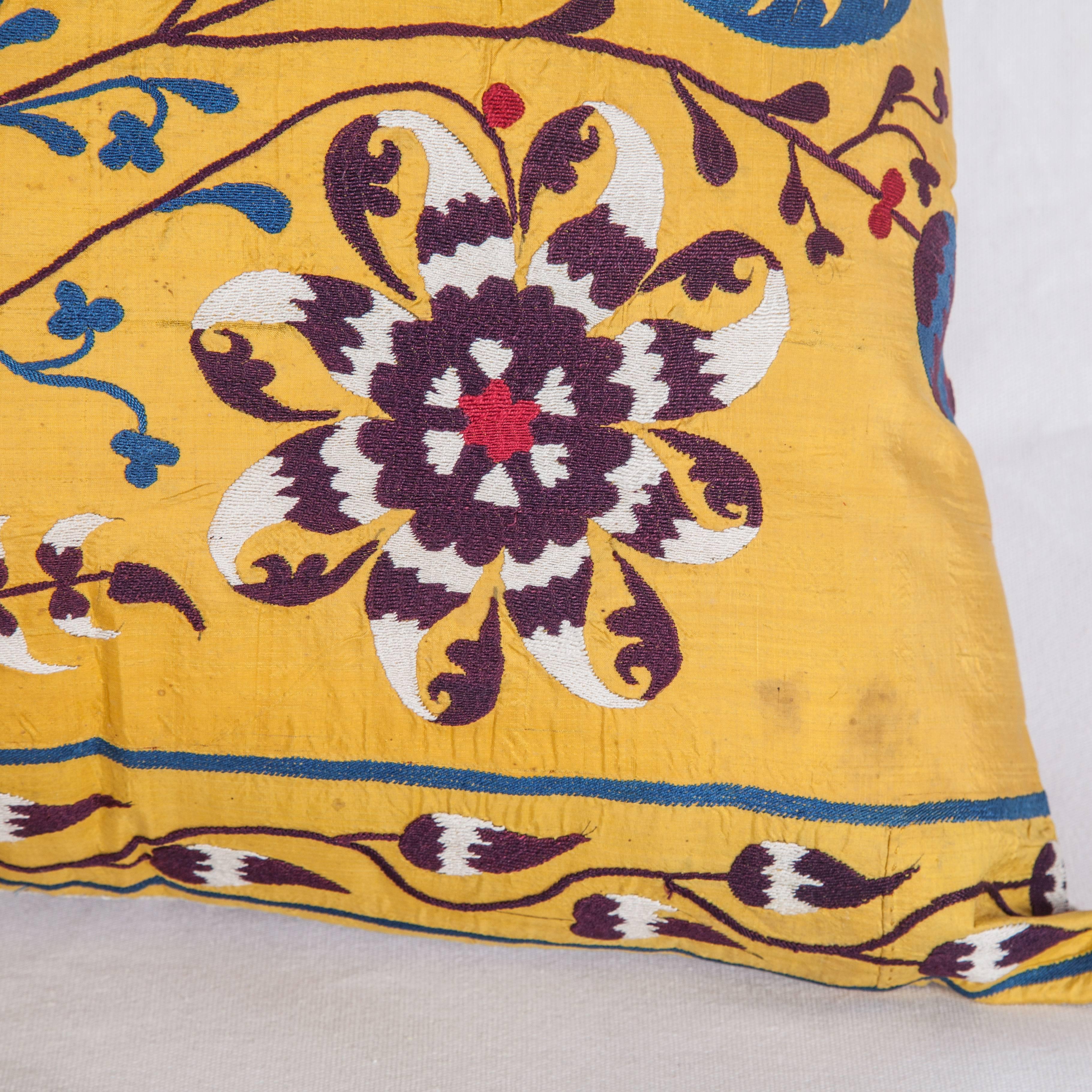 The pillow is made out of an early 20th century, Uzbek Samarkand silk Suzani. It does not come with an insert but it comes with a bag made to the size and out of cotton to accommodate the filling.
The backing is made of linen. Please note ' filling