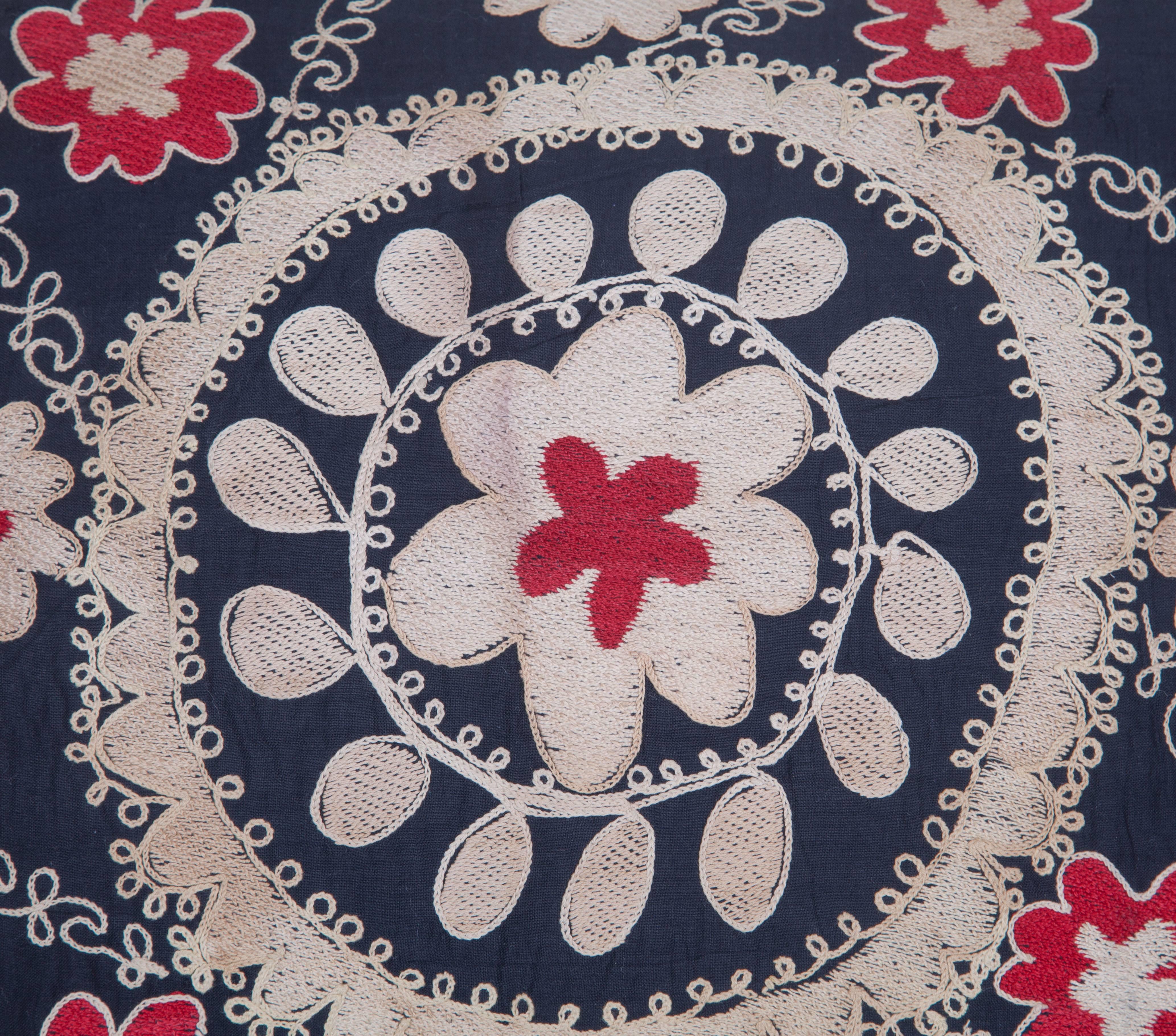 The pillow is made out of mid-20th century, Uzbek Samarkand Suzani. It does not come with an insert but it comes with a bag made to the size and out of cotton to accommodate the filling. The backing is made of linen. Please note ' filling is not