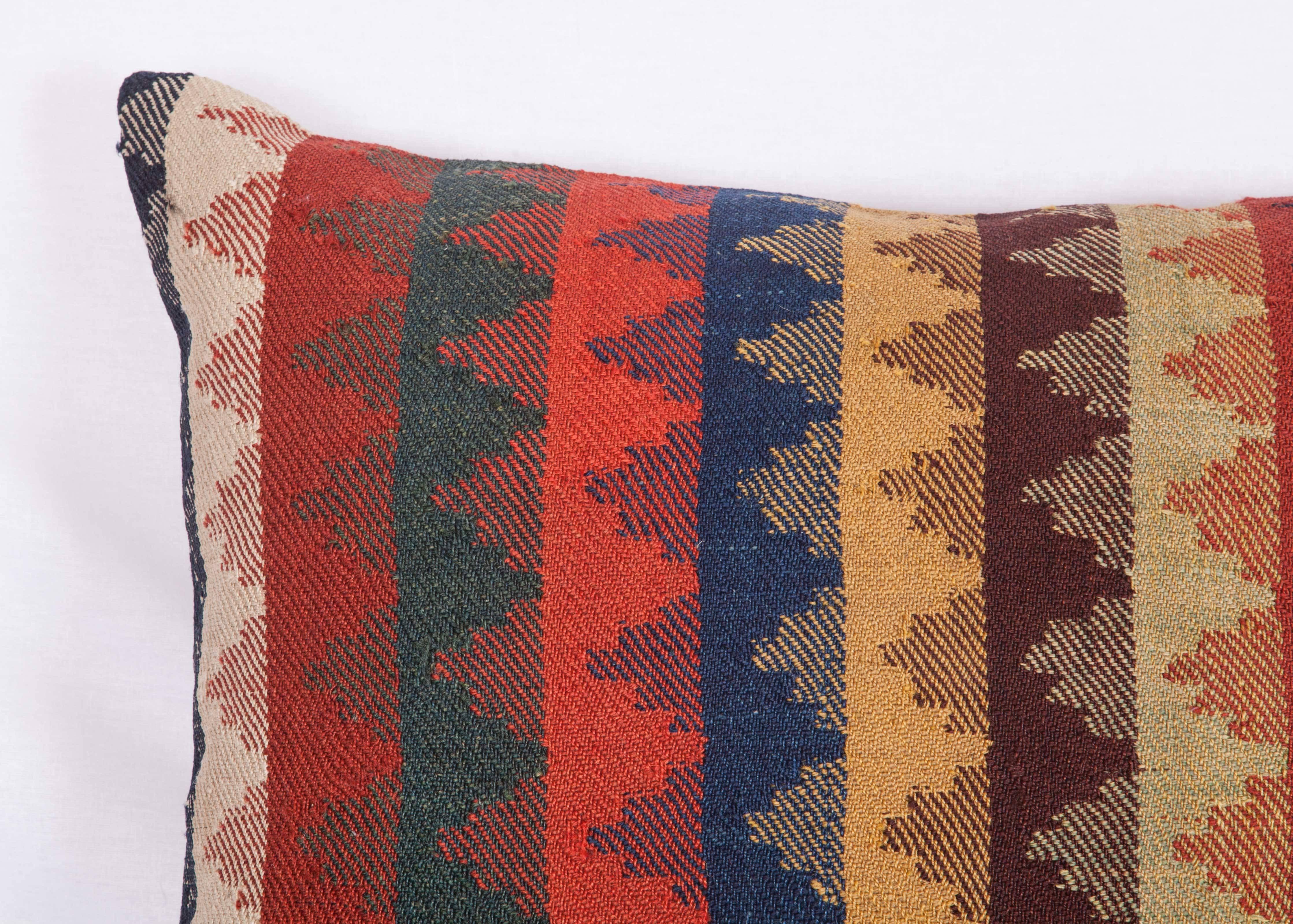 Pillow is made out of a late 19th century South Persian, Kashgai Kilim fragment. It does not come with an insert but it comes with a bag made to the size and out of cotton to accommodate the filling. The backing is made of linen. Please note filling