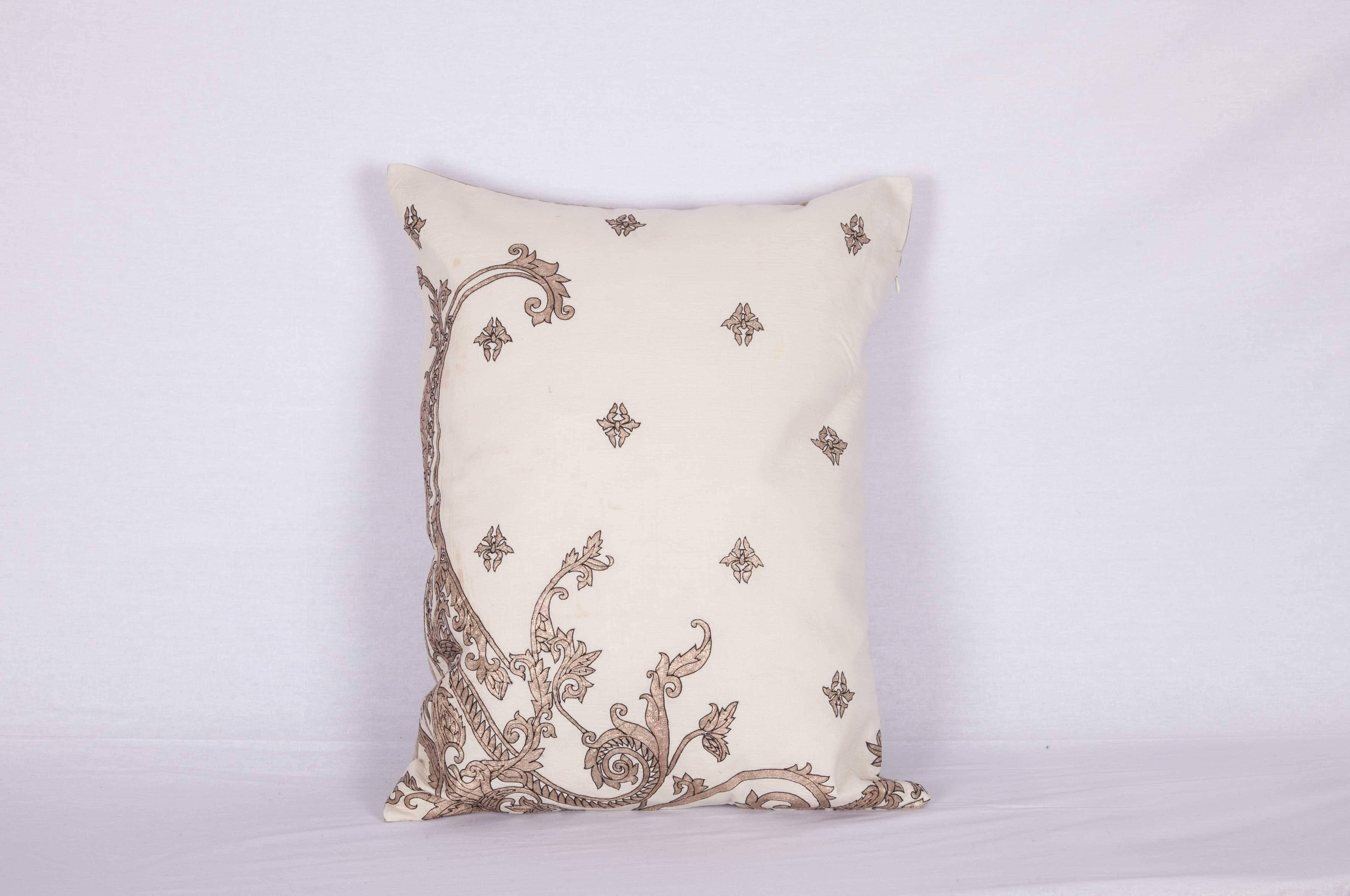The pillow is made out of a 19th century or earlier European silver embroidery. It does not come with an insert but it comes with a bag made to the size and out of cotton to accommodate the filling. The backing is made of linen. Please note '