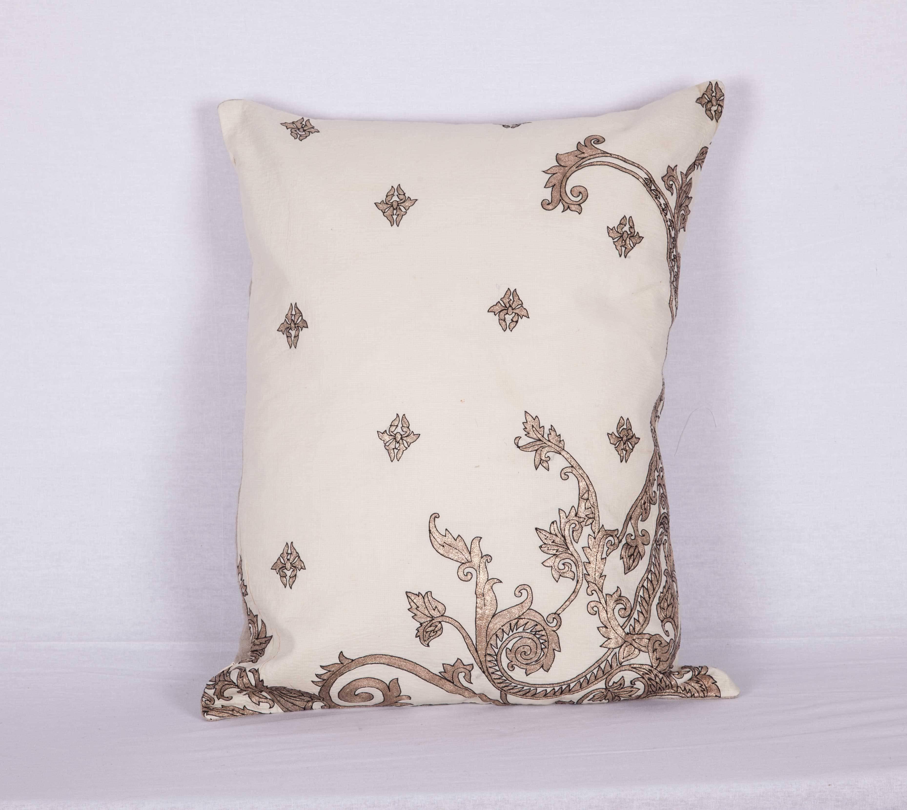 The pillow is made out of a 19th century or earlier European silver embroidery. It does not come with an insert but it comes with a bag made to the size and out of cotton to accommodate the filling. The backing is made of linen. Please note '