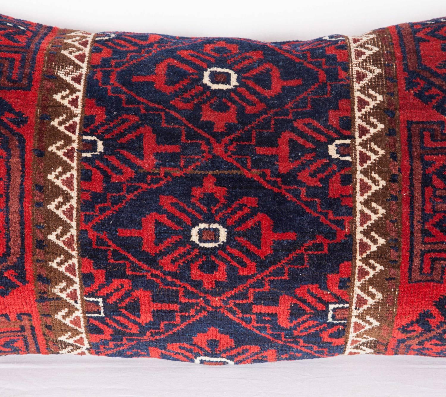 The pillow is made out of a late 19th century, Baluch rug fragment. It does not come with an insert but it comes with a bag made to the size and out of cotton to accommodate the filling. The backing is made of linen. Please note filling is not