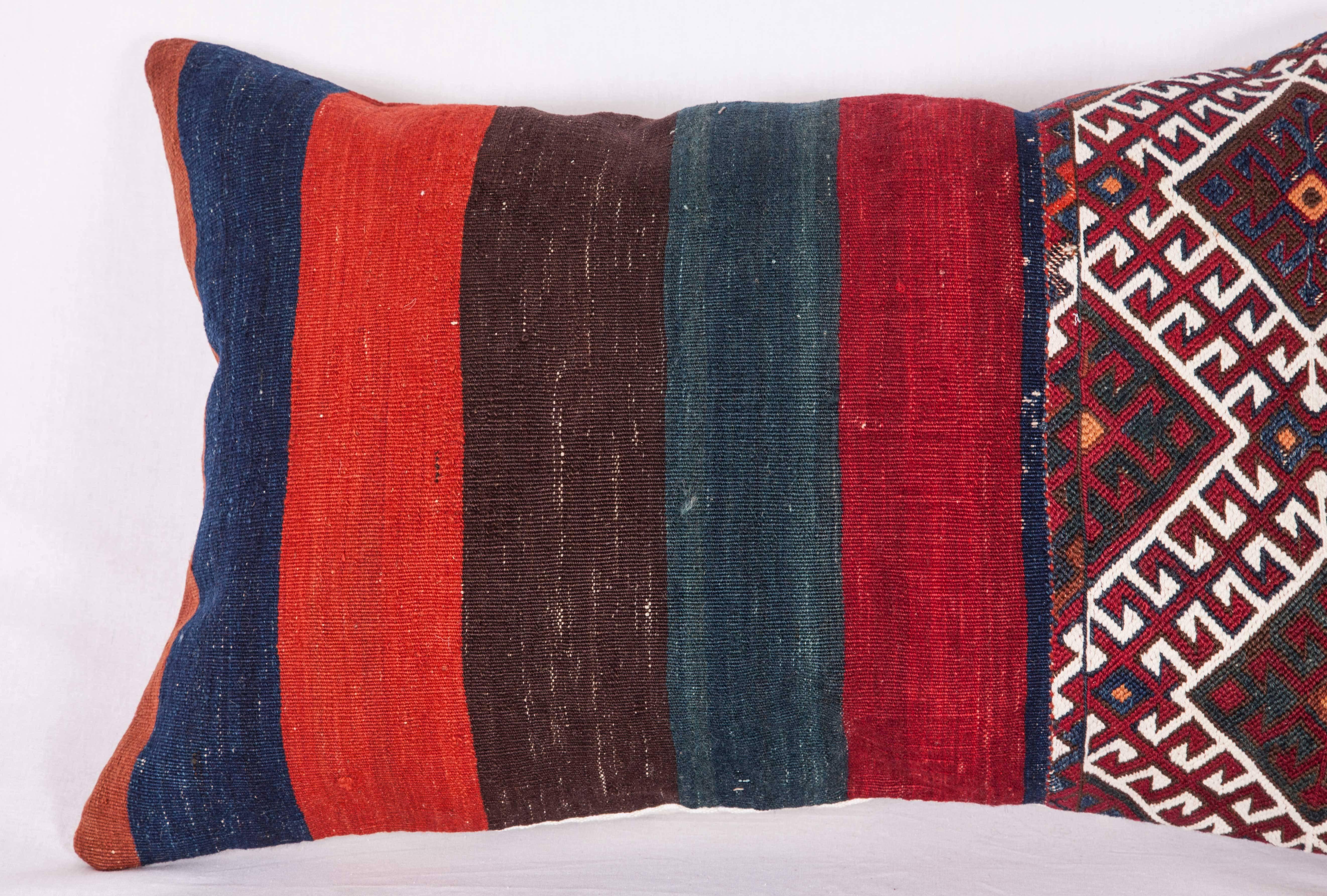 The pillow is made out of 19th century Anatolian bag. It does not come with an insert but it comes with a bag made to the size and out of cotton to accommodate the filling. The backing is made of vintage Anatolian cotton and wool textile. Please
