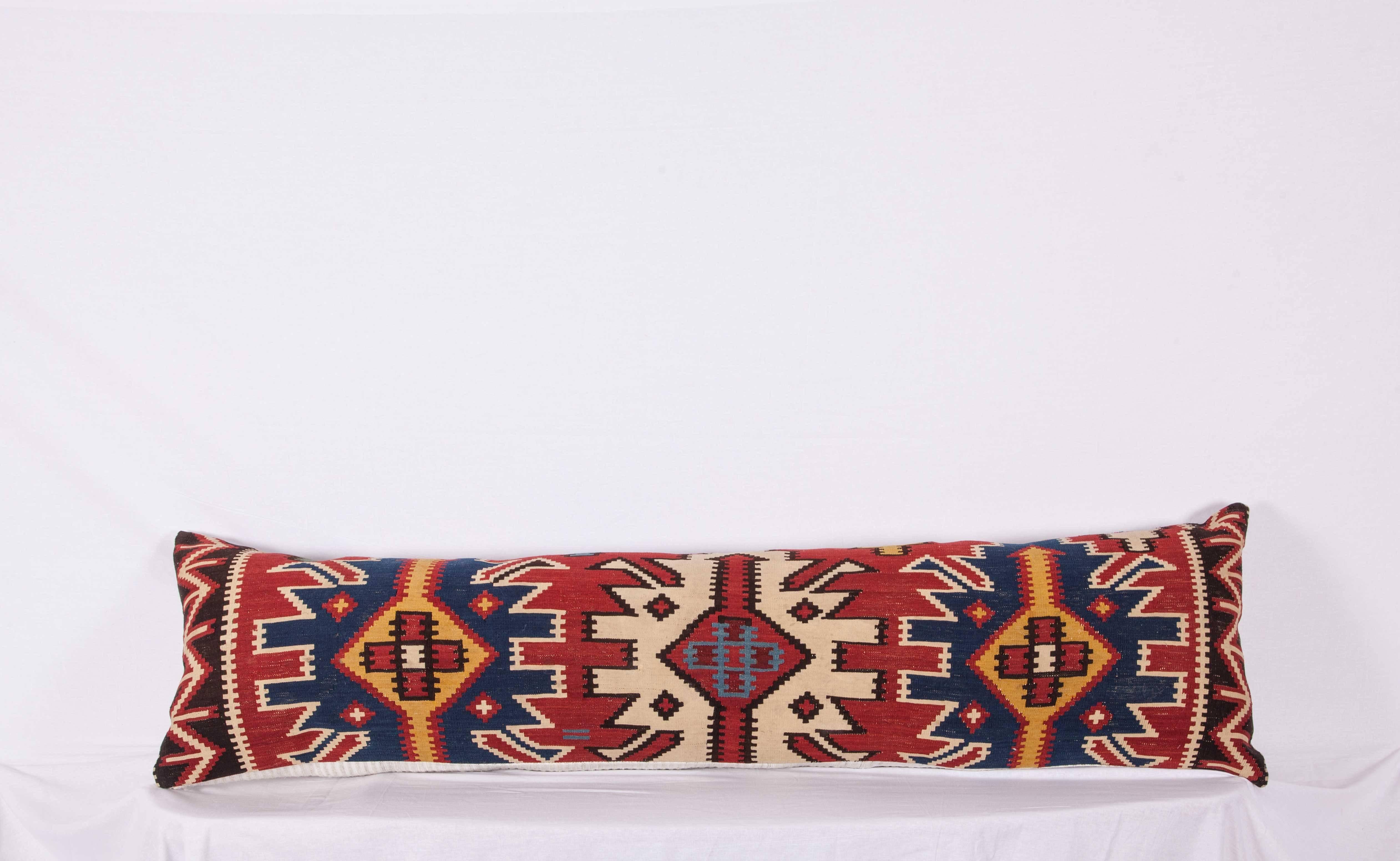 This very pillow is a very long one measure: 43 x 159 cm / 16.93 x 62.6 inches and made out of a great 19th Century Caucasian Kuba Kilim. It does not come with inserts but come with a bag made to the size and out of cotton to accommodate the