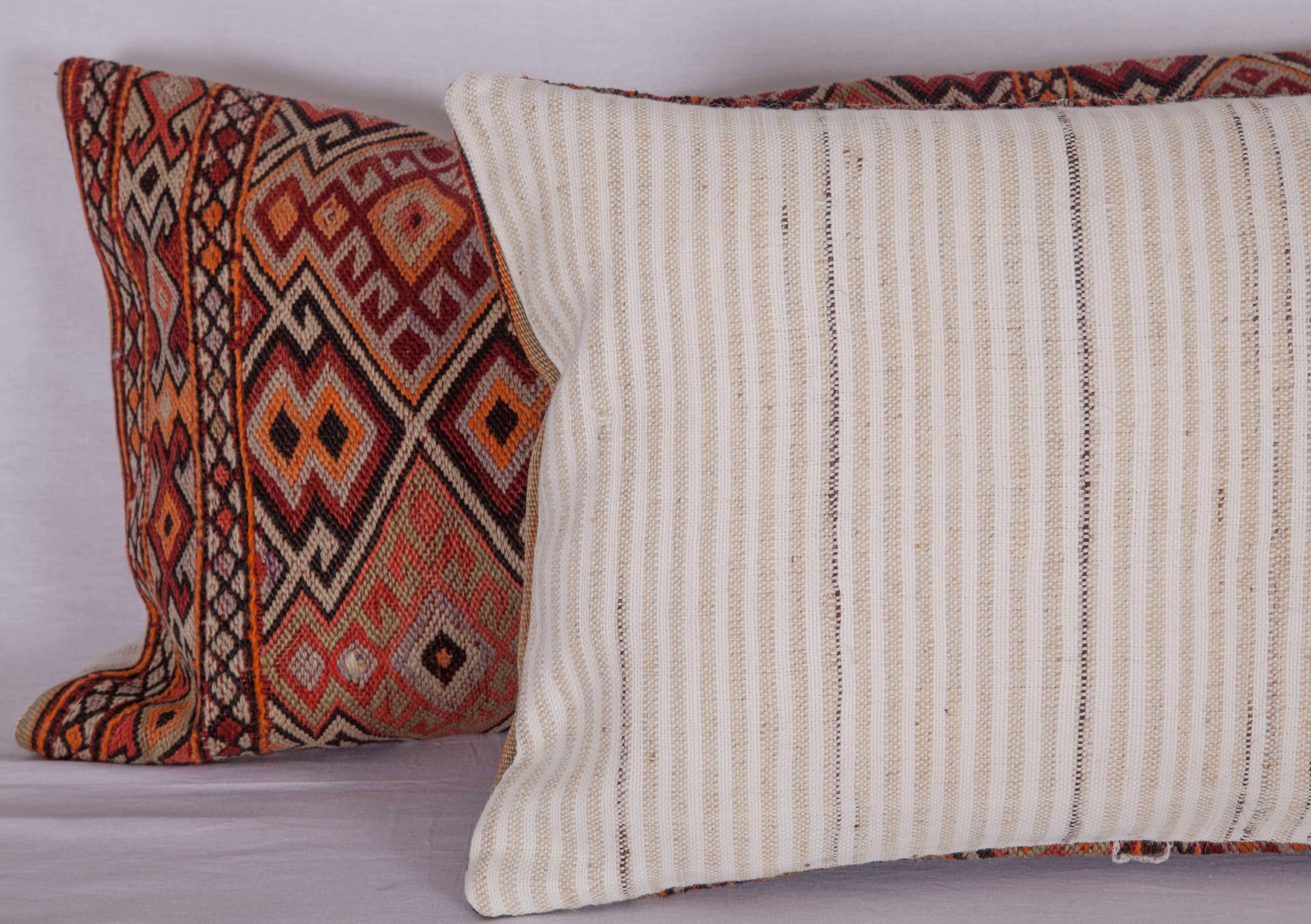 Pillows are made from an Anatolian Sumak Kilim. They do not come with inserts but come with bags made to the size to accomodate insert materials. Hand loomed vintage cotton and wool fabric in the back.

dry clean only.